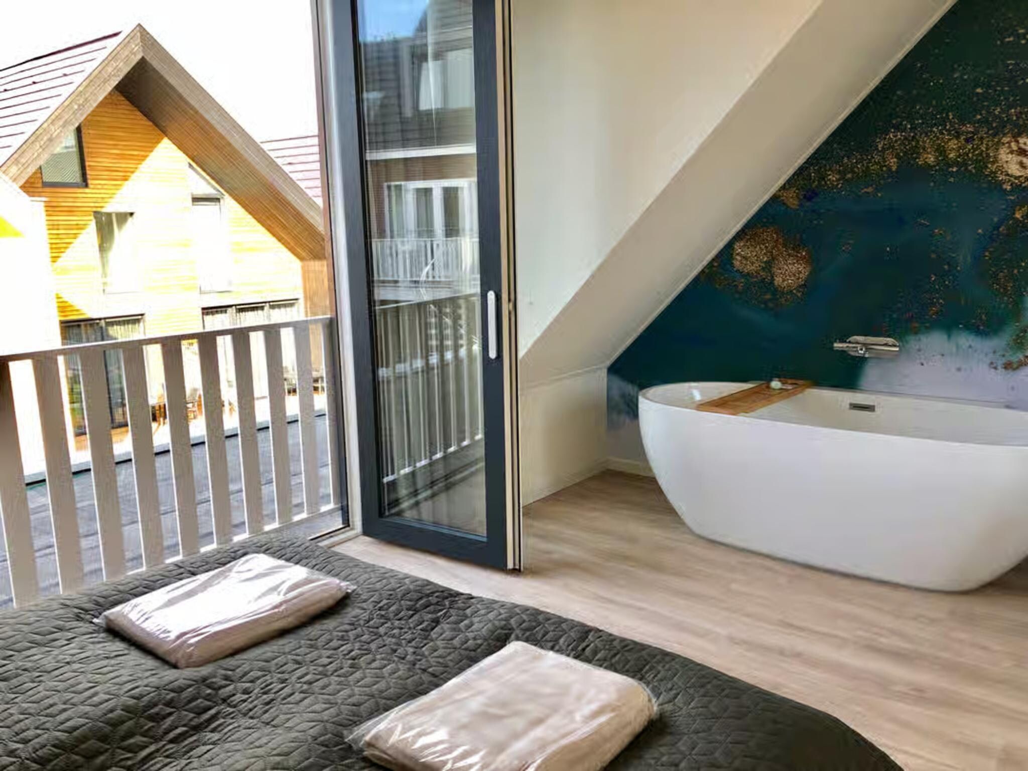 Een slaapkamer van Plein 40 Lodge 7 in Zoutelande