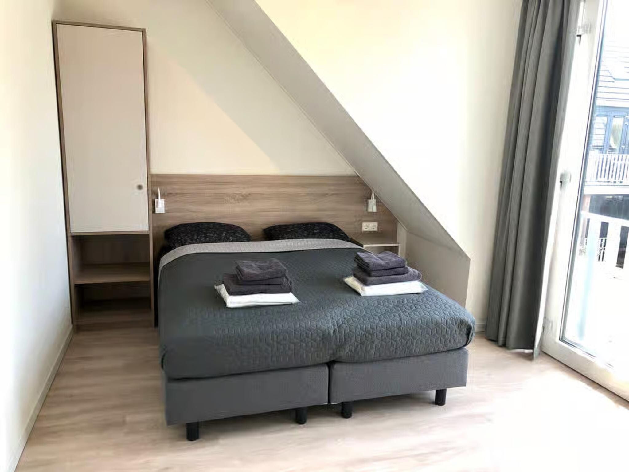 Een slaapkamer van Plein 40 Lodge 7 in Zoutelande
