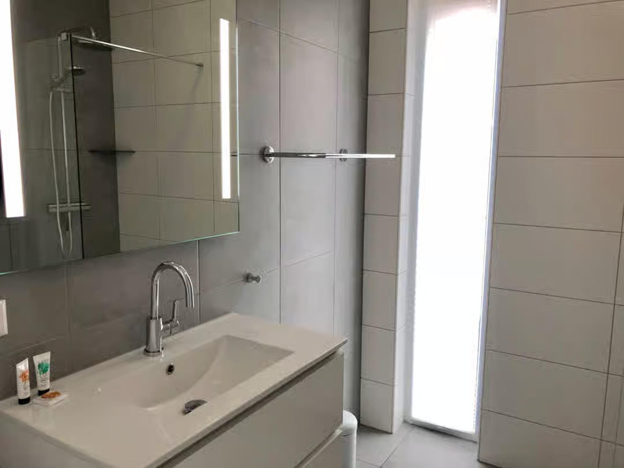 De badkamer van Plein 40 Lodge 8 in Zoutelande