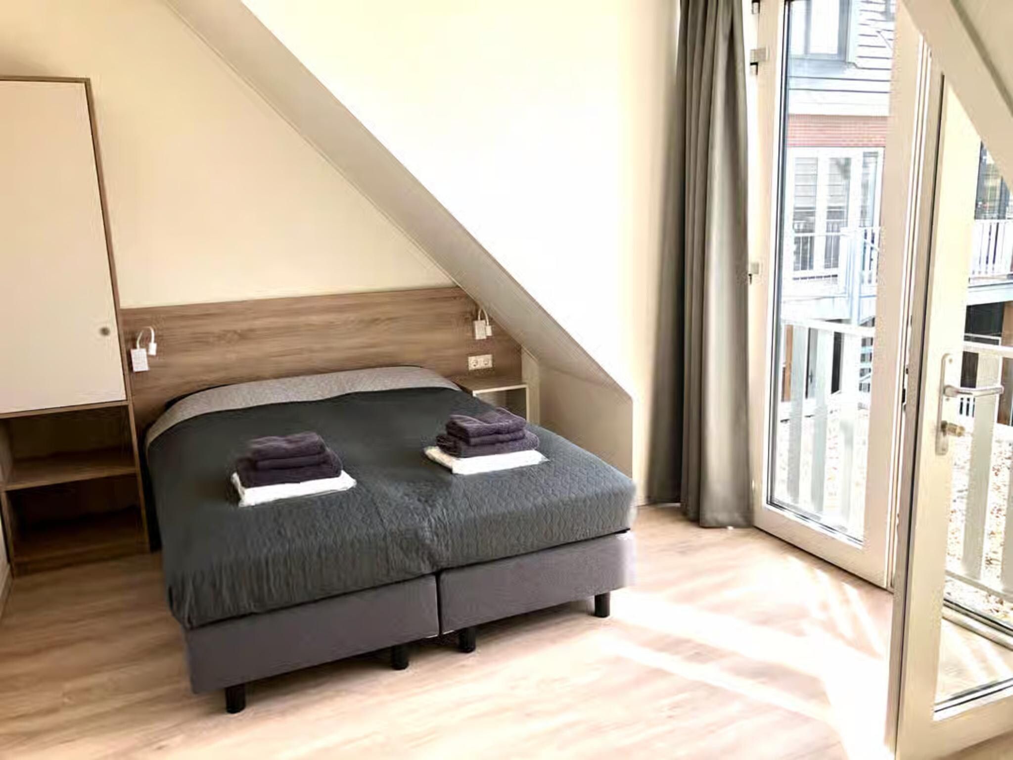 Een slaapkamer van Plein 40 Lodge 8 in Zoutelande