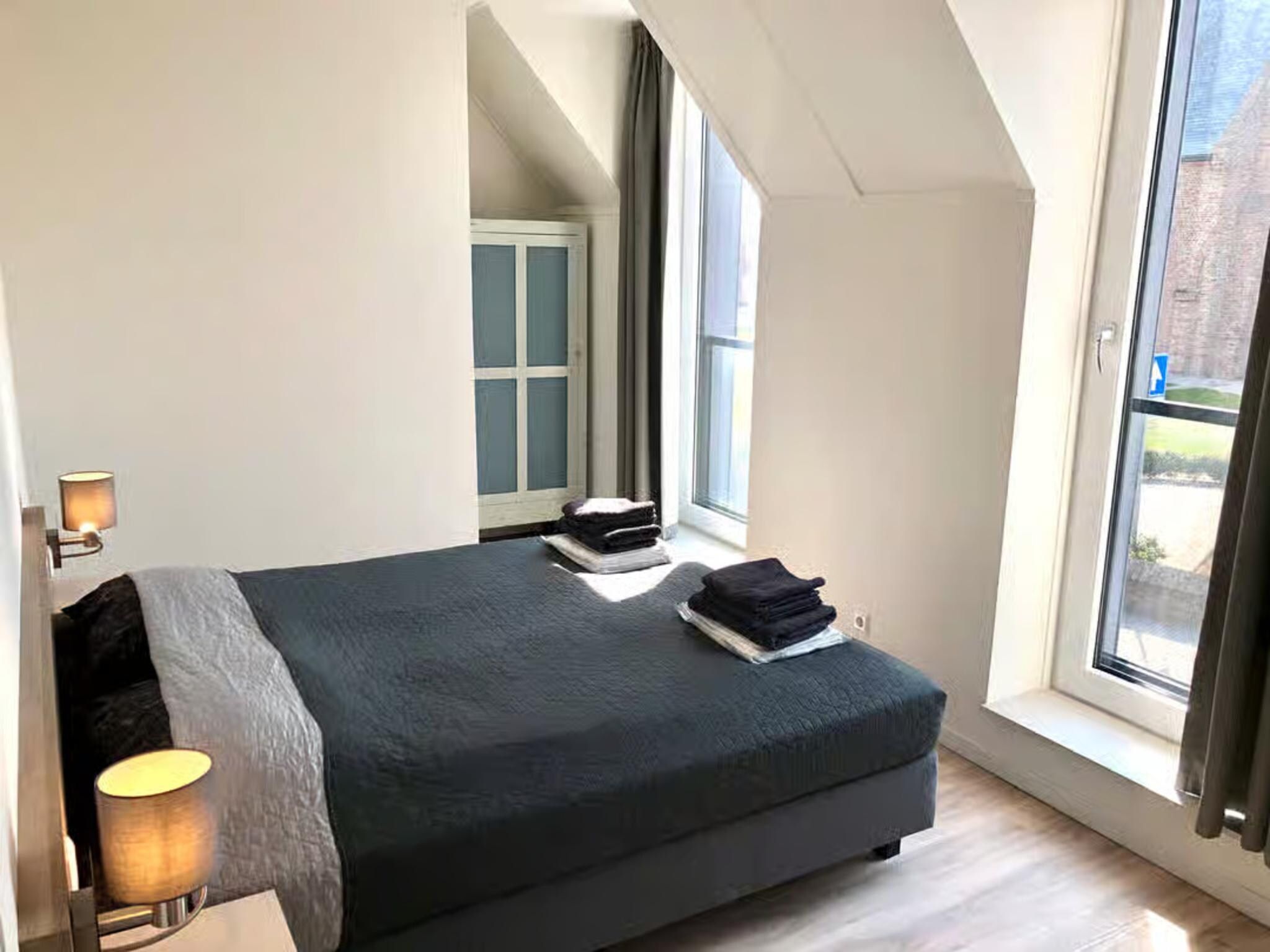Een slaapkamer van Plein 40 Lodge 20 in Zoutelande