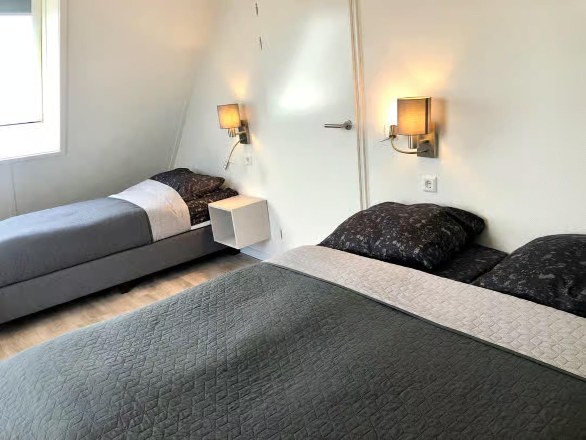 Een slaapkamer van Plein 40 Lodge 20 in Zoutelande