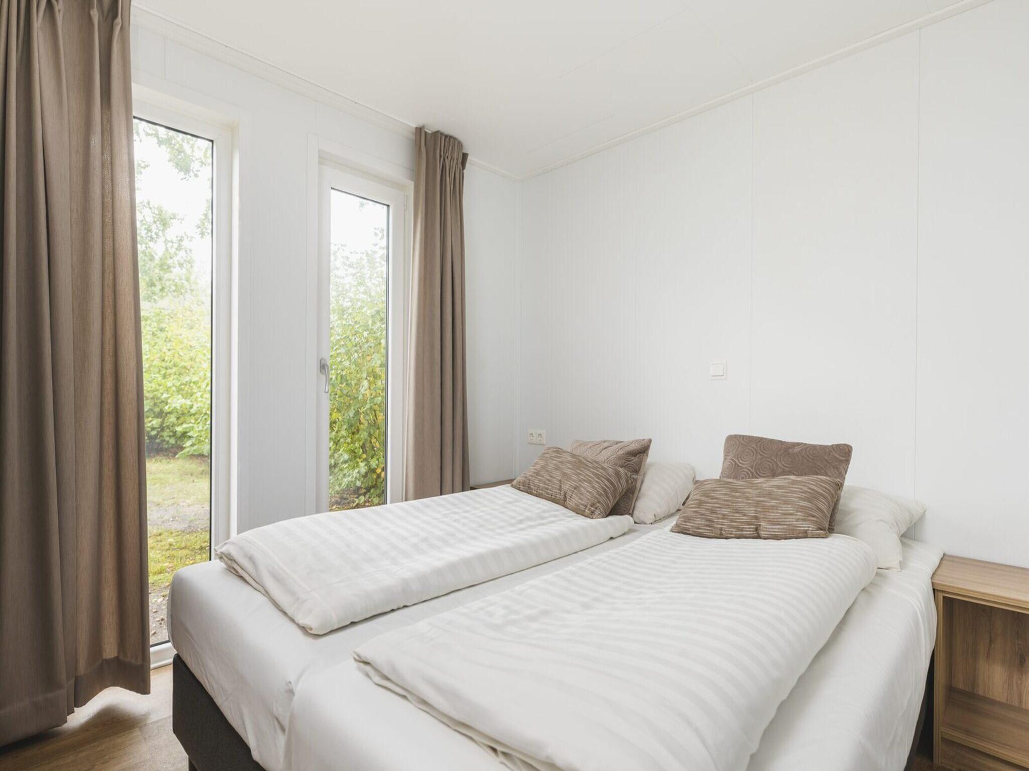 Een slaapkamer van Forest lodge | 6 people in Rijssen