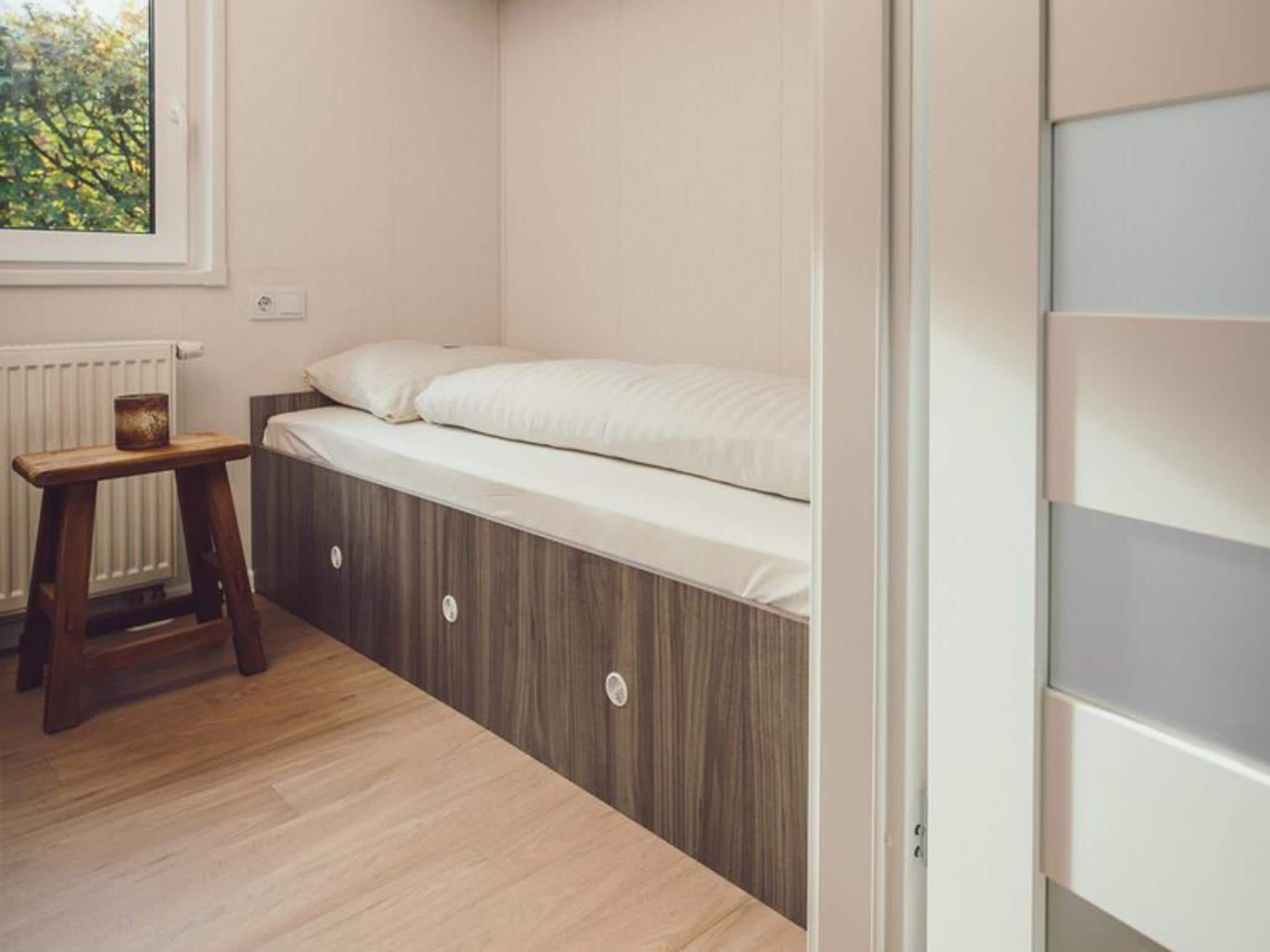 Een slaapkamer van Tiny Cabin with Hottub I 4 people in Rijssen