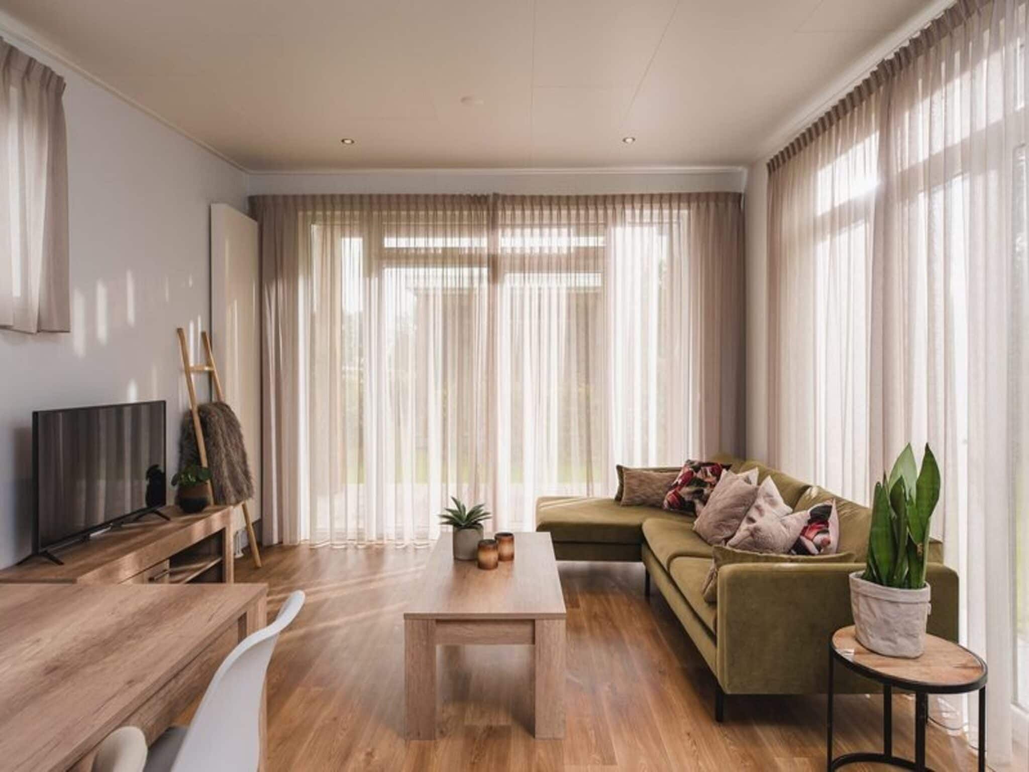 De woonkamer van Luxury lodge with private sauna | 6 people in Rijssen