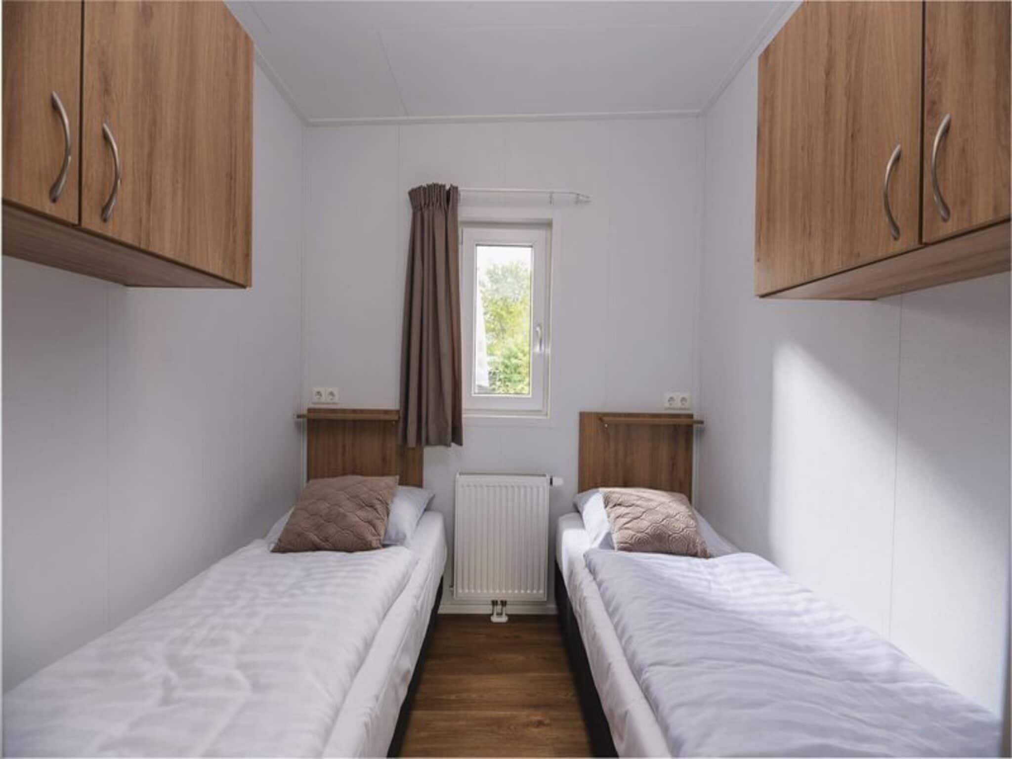 Een slaapkamer van Luxury lodge with private sauna | 6 people in Rijssen