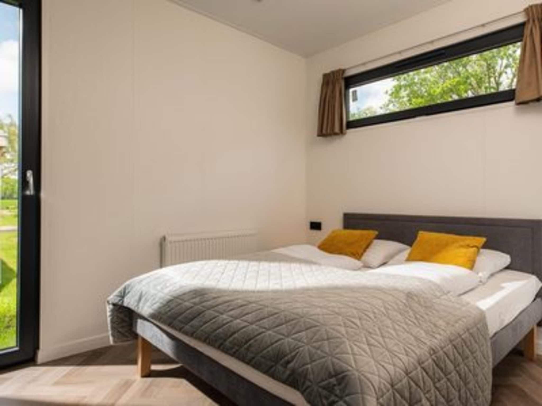 Een slaapkamer van Oak Lodge I 4 people in Rijssen