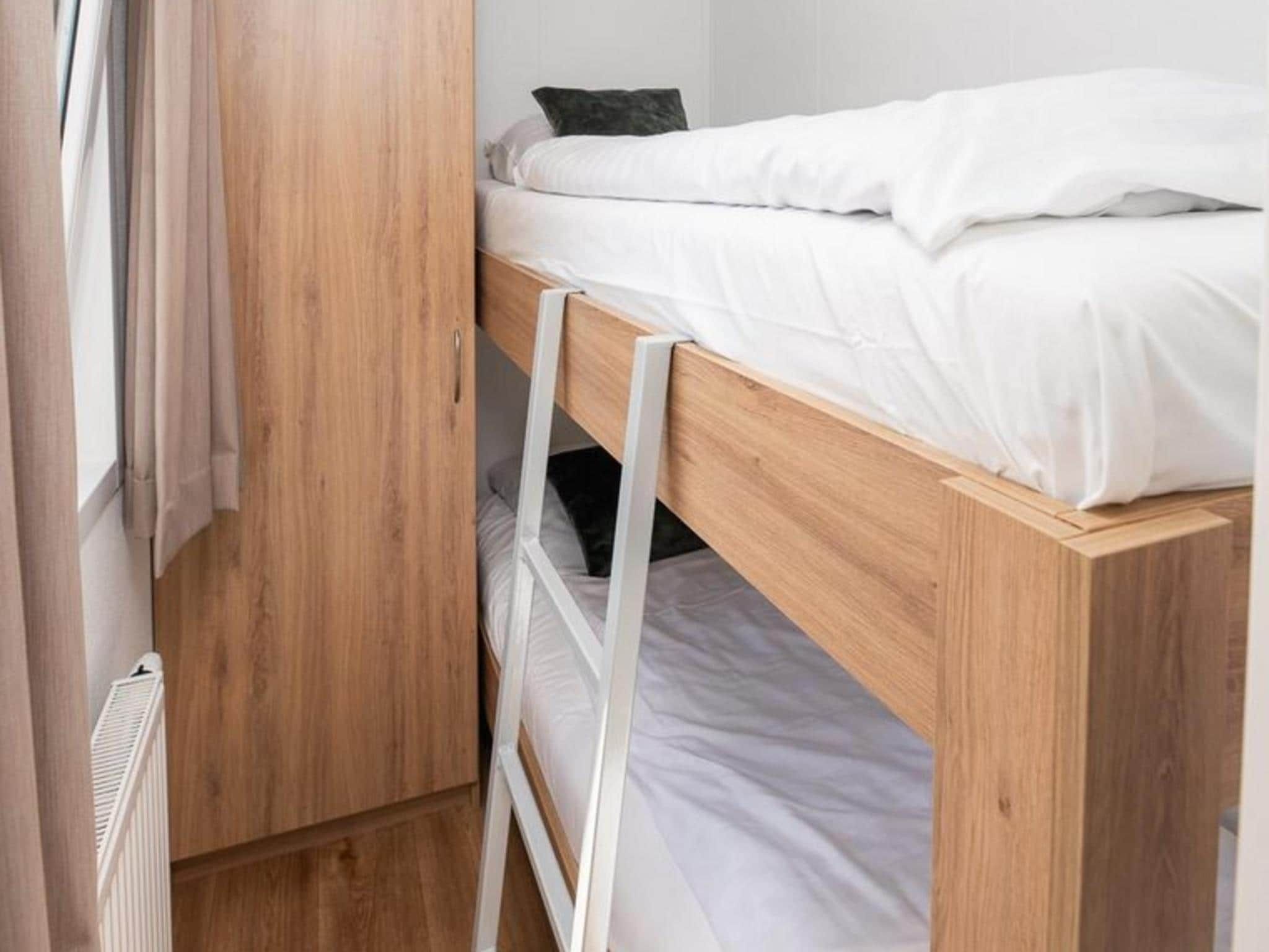 Een slaapkamer van River Cabin with hot tub | 6 people in Zuna