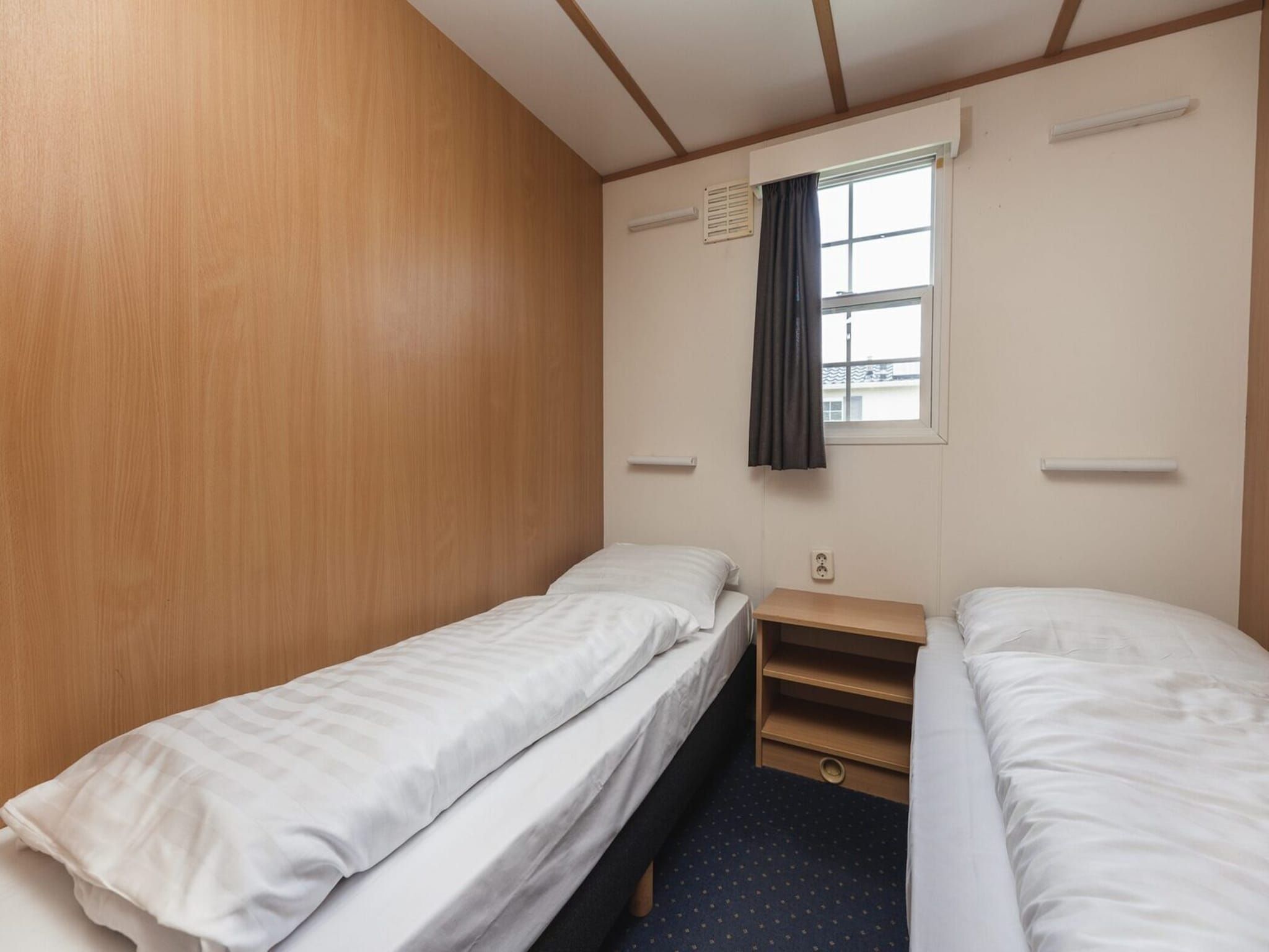 Een slaapkamer van Bungalette basic with hot tub I 4 people in Zuna
