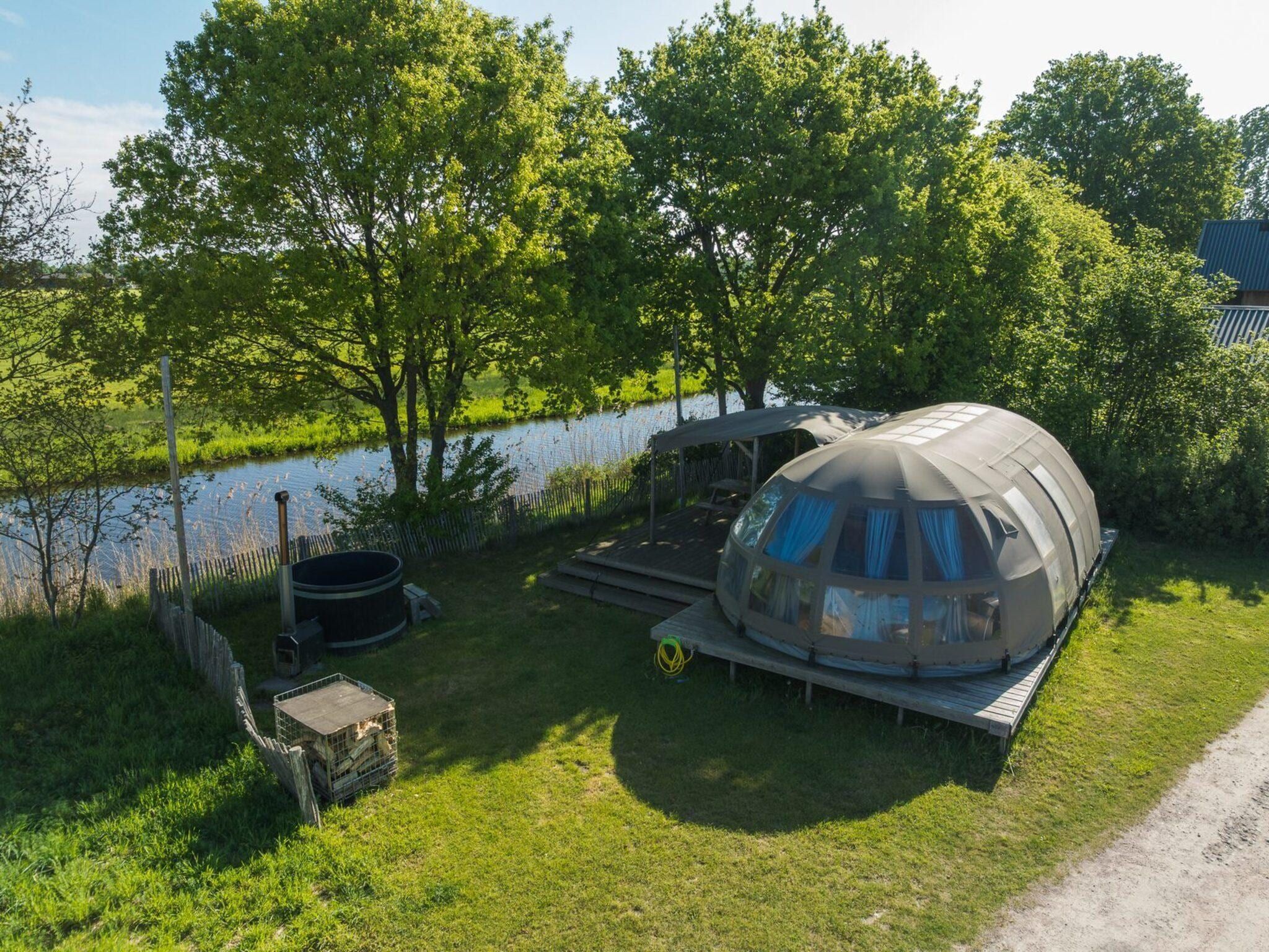 De buitenkant van Riverdome with private bathroom and hot tub | 4 persons in Zuna