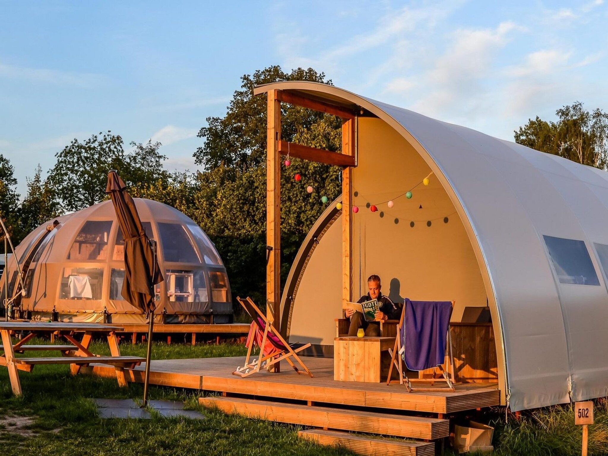 Het terras van Group accommodation (6x luxury glamping tent) I 32 people in Zuna