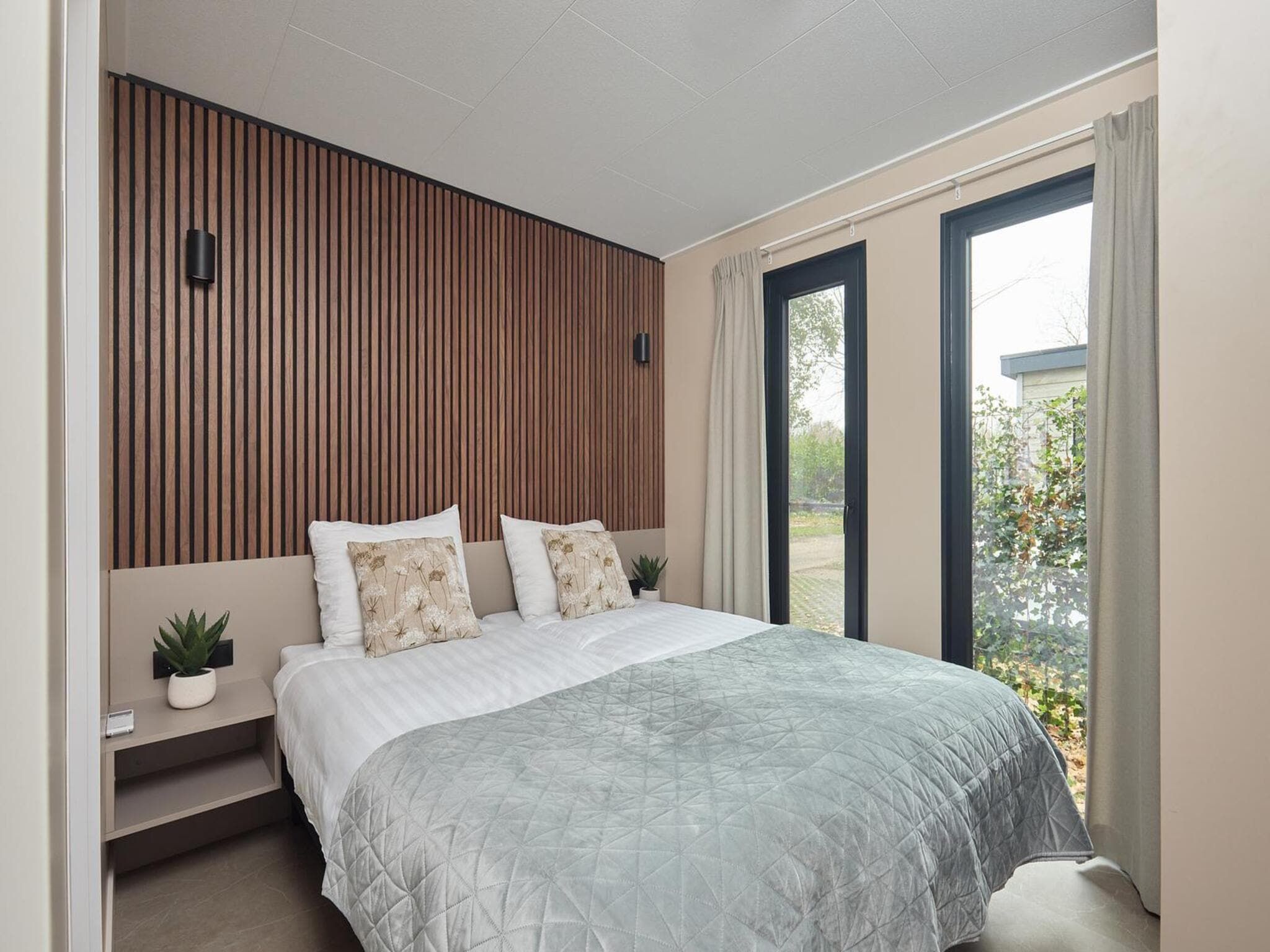 Een slaapkamer van Wellness Boutique baby | 4 people + baby room in Zuna
