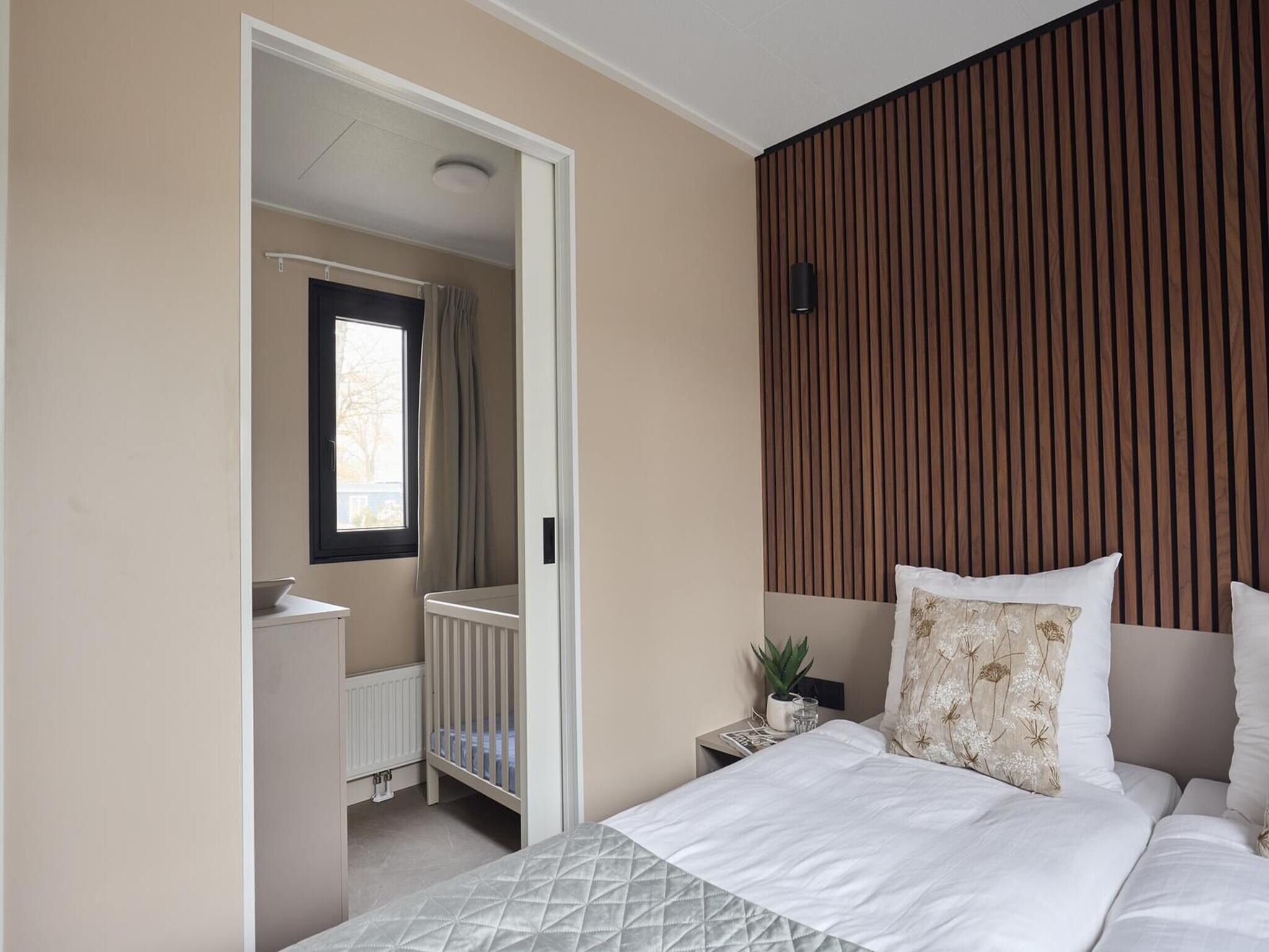 Een slaapkamer van Wellness Boutique baby | 4 people + baby room in Zuna