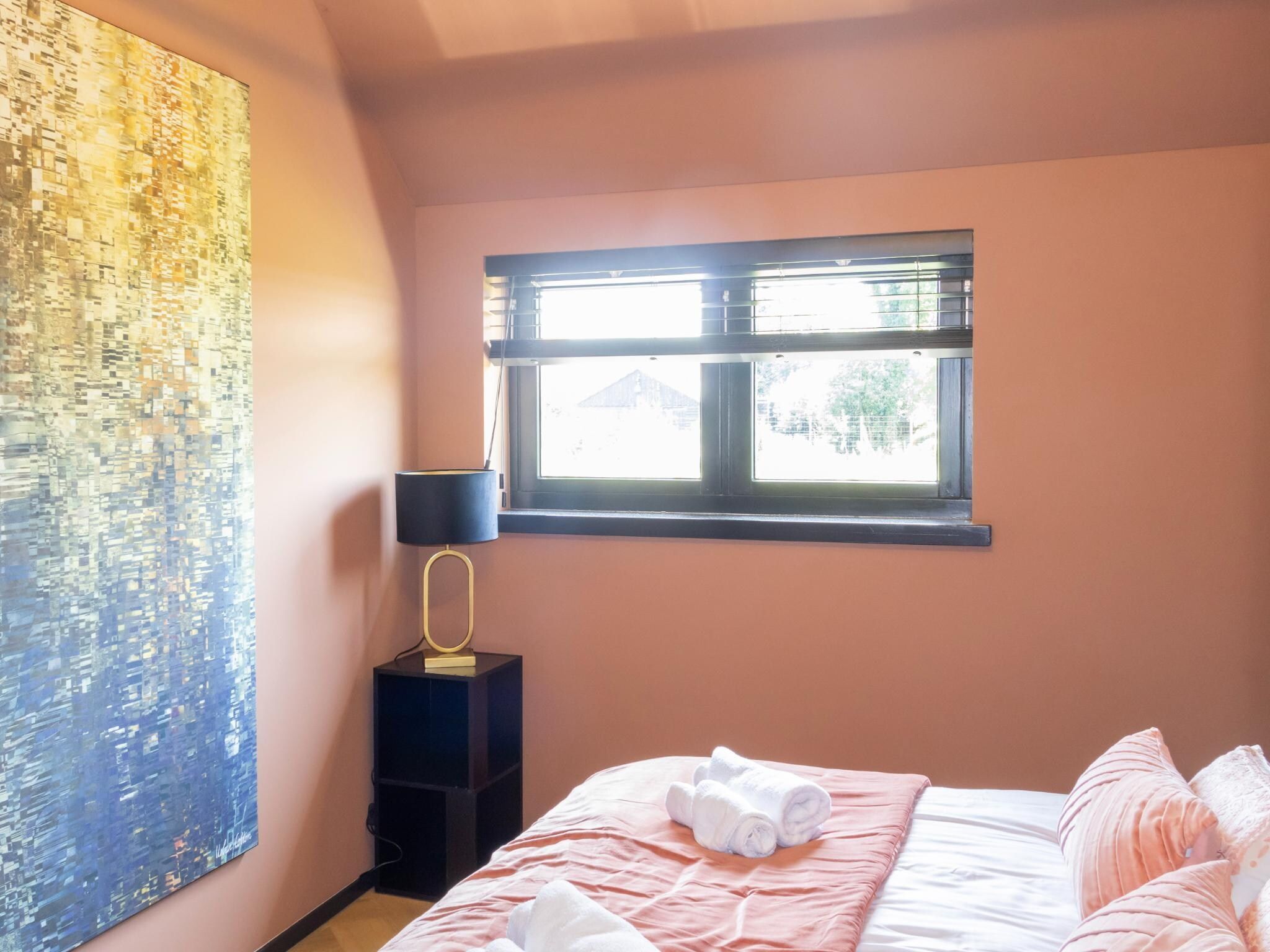 Een slaapkamer van Eindeloos Uitzicht in Kiel-Windeweer