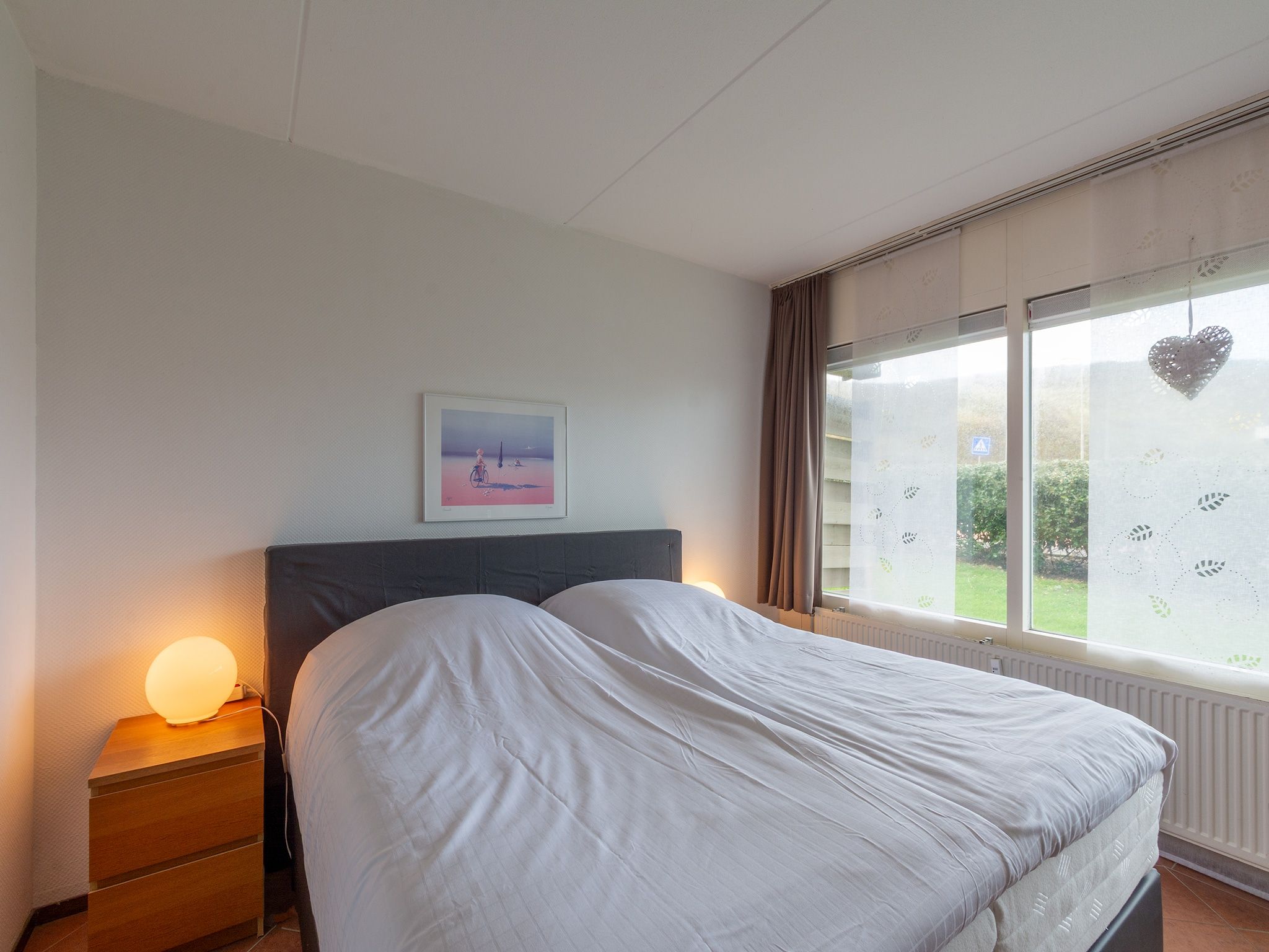 Een slaapkamer van Beach Appartement 04 in Callantsoog