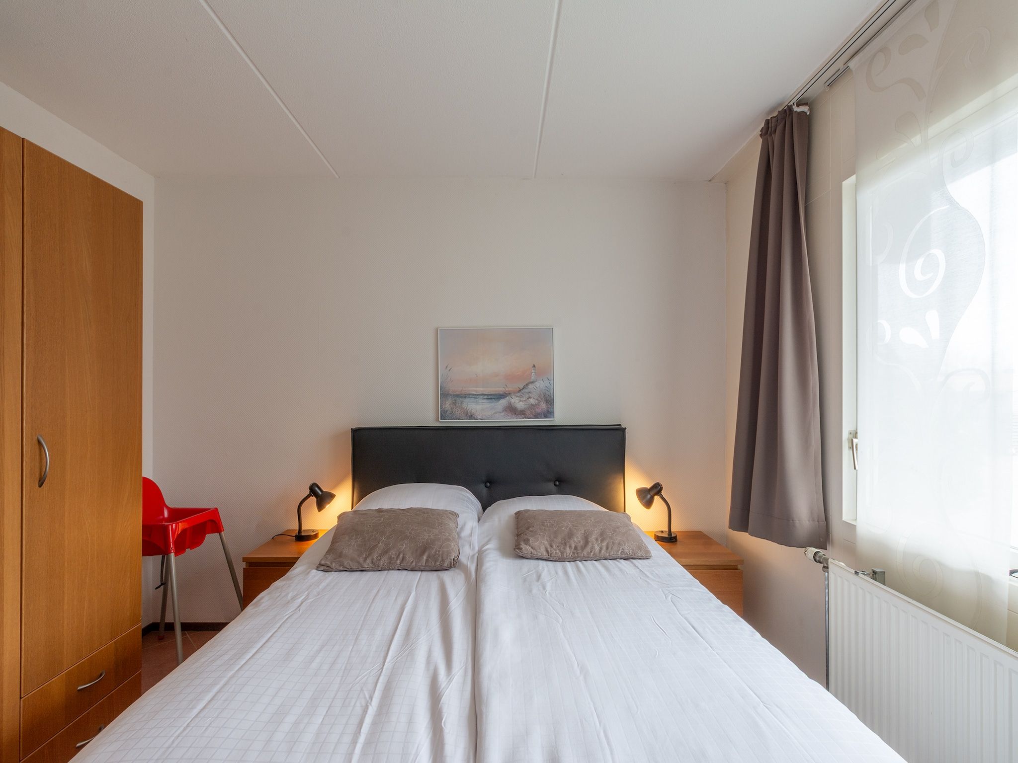 Een slaapkamer van Beach Appartement 04 in Callantsoog