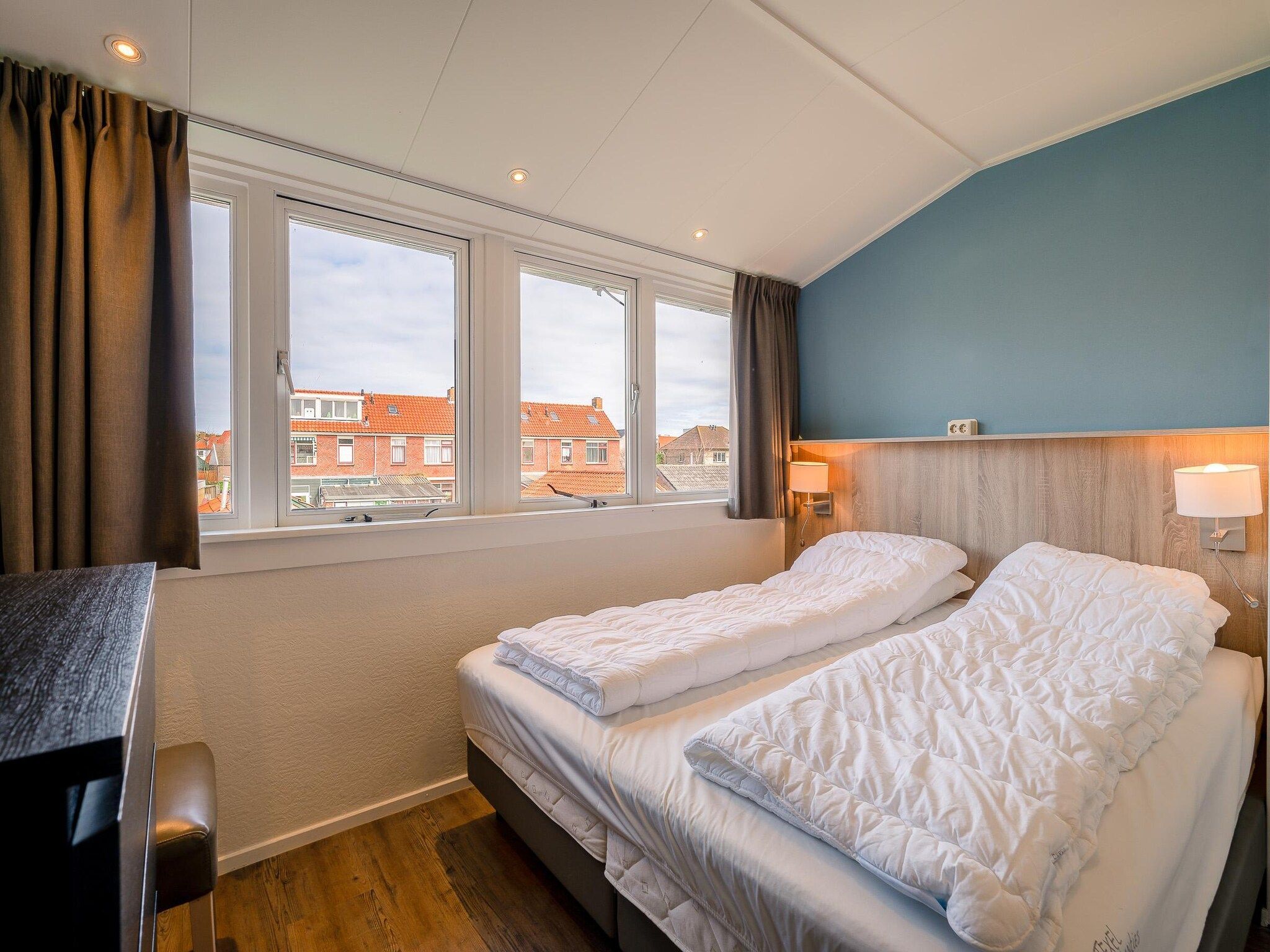 Een slaapkamer van Brink 24 - De Bosruiter in De Koog