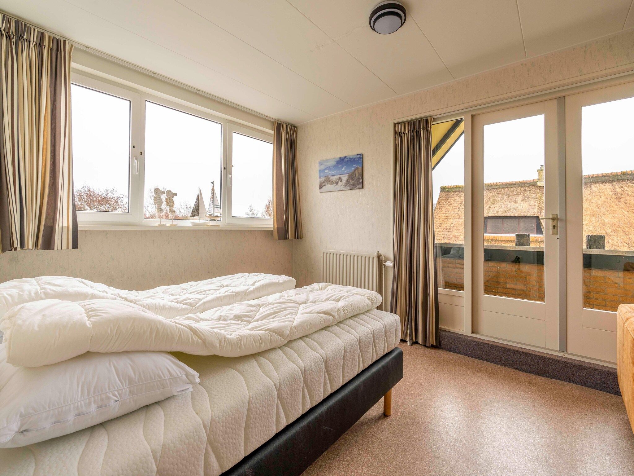 Een slaapkamer van Ruijslaan 69 - Huis Ter Duin in De Koog