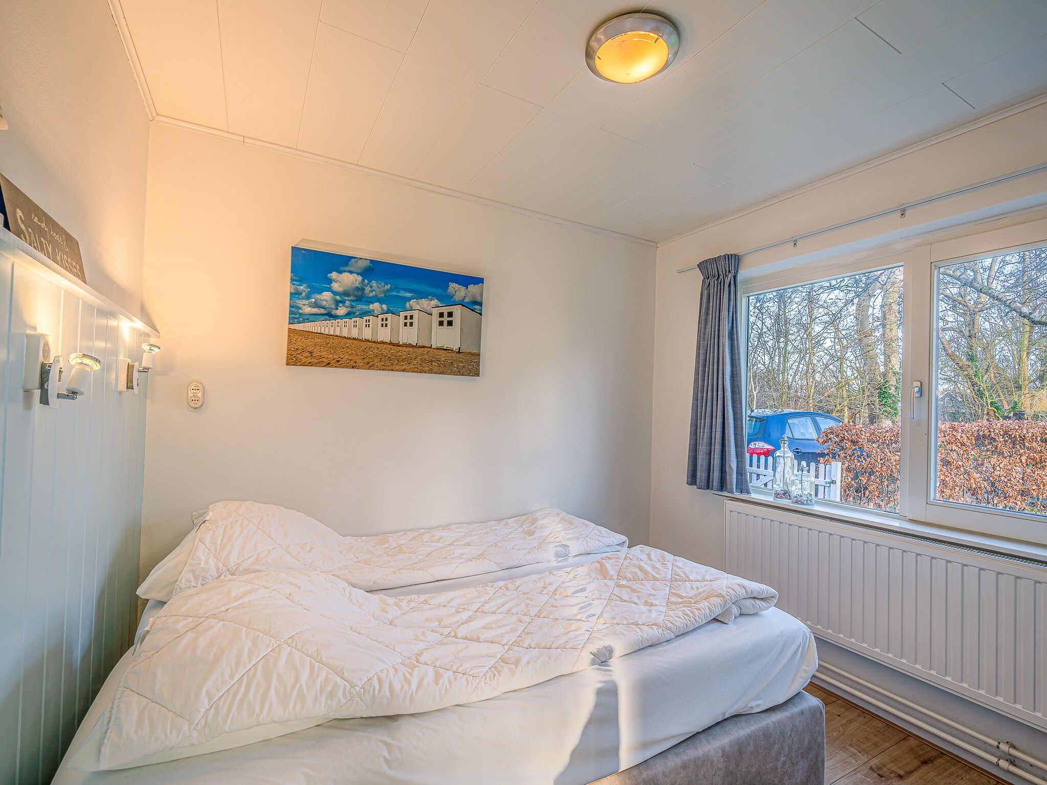 Een slaapkamer van Vredelust 57 in De Koog