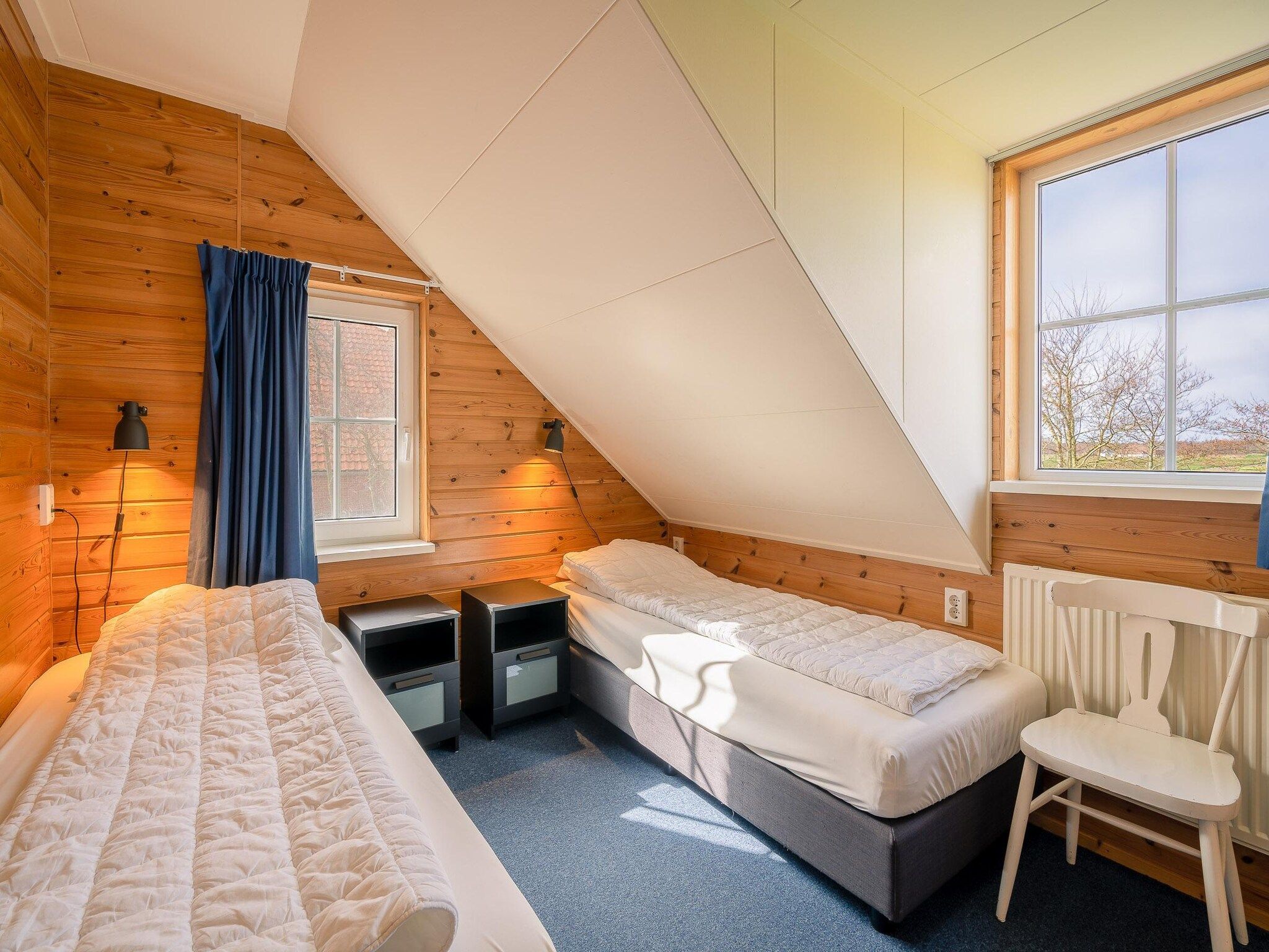 Een slaapkamer van De Annabella 13- De Tjiftjaf in De Koog