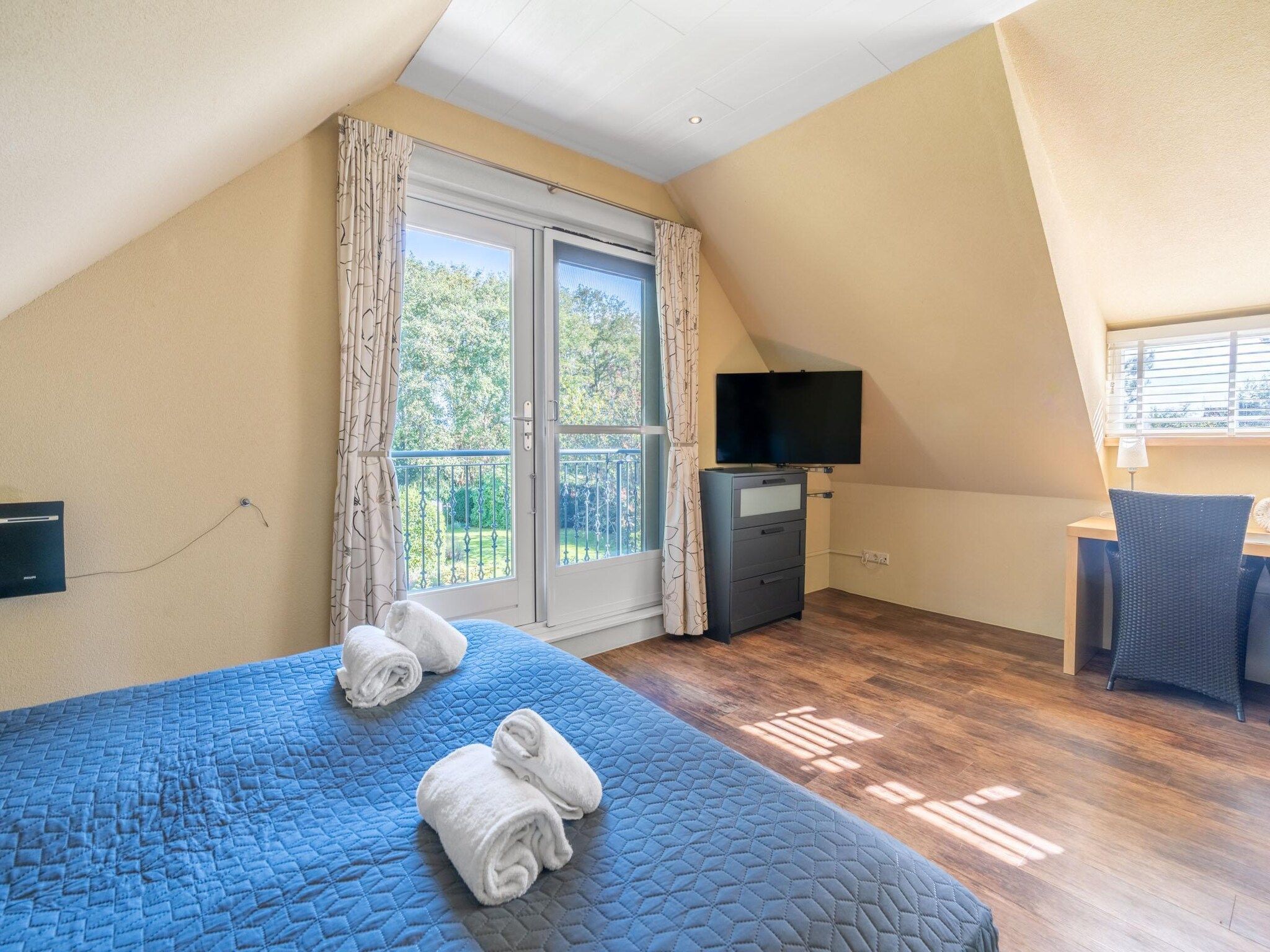 Een slaapkamer van Tempelierweg 22 in Den Burg