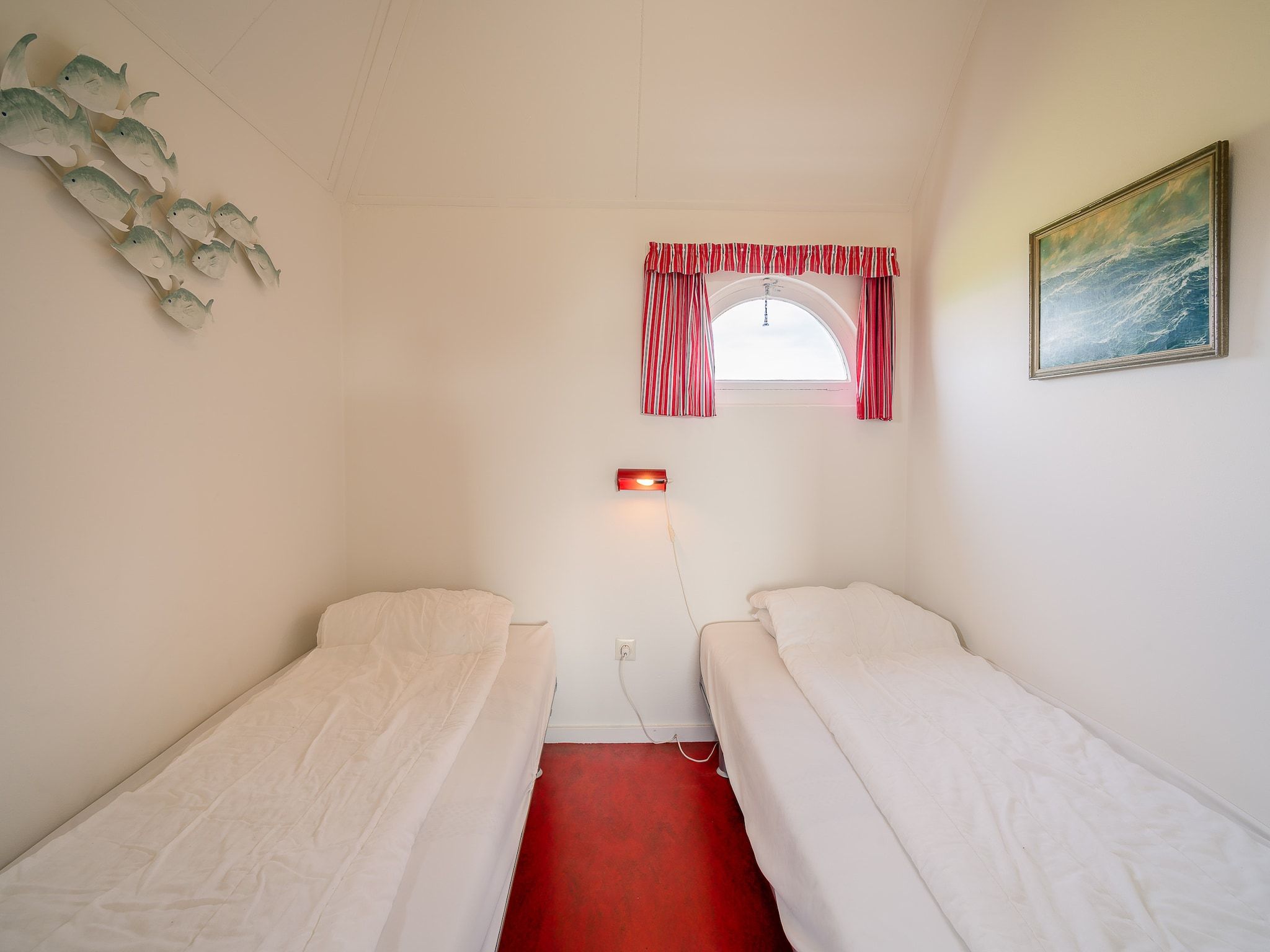 Een slaapkamer van De Boet Waalenburg in De Koog