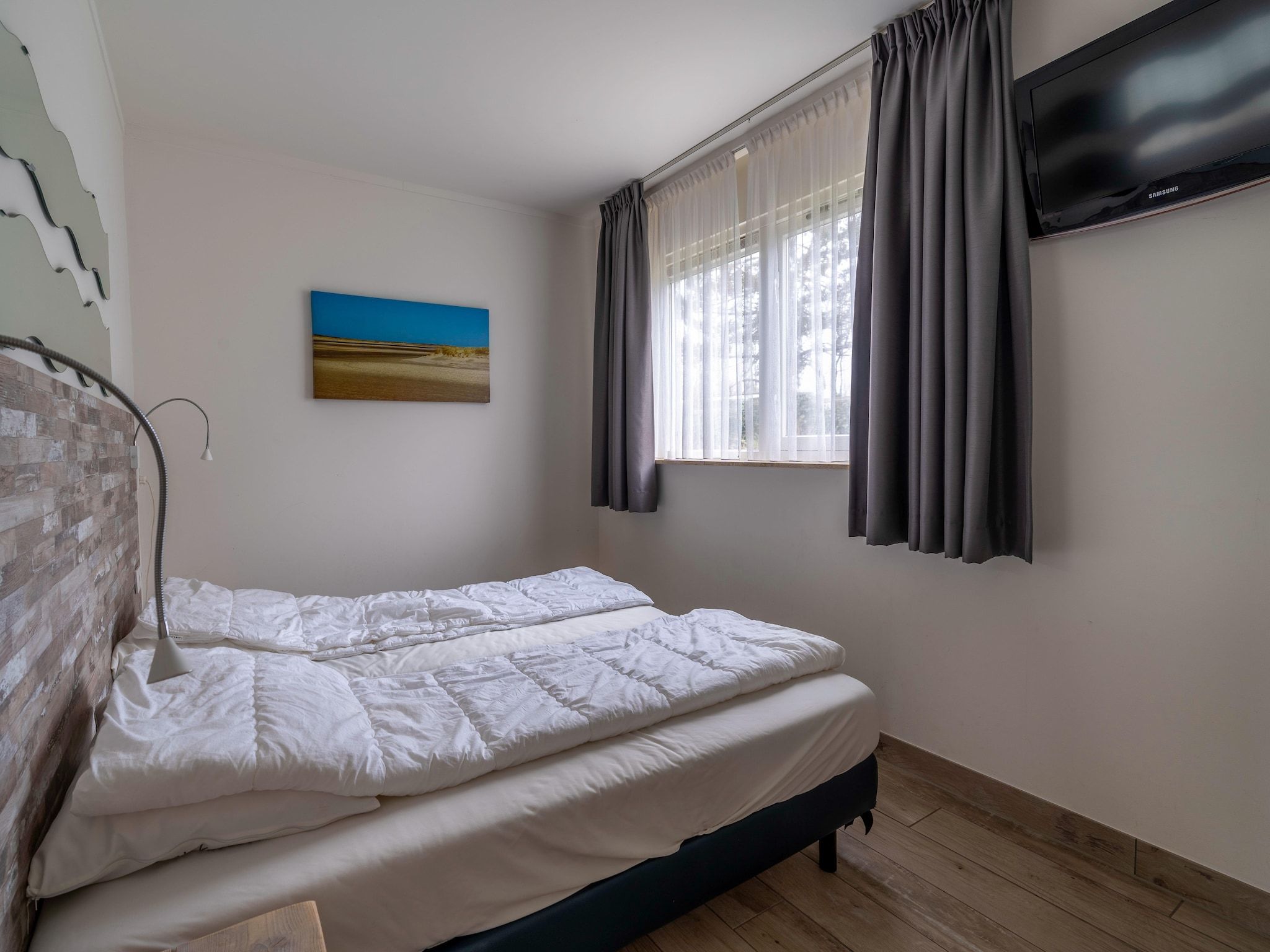 Een slaapkamer van Texelfan Californieweg 9A in De Koog
