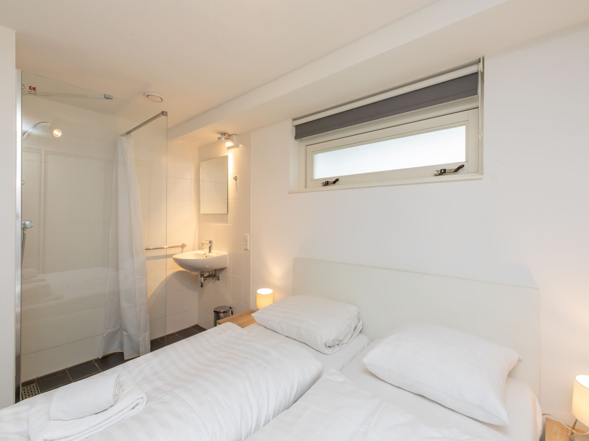 Een slaapkamer van Zonnedorp 21  Beach Villa Joya Renesse | Luxury Beach Villa with Sauna in Renesse