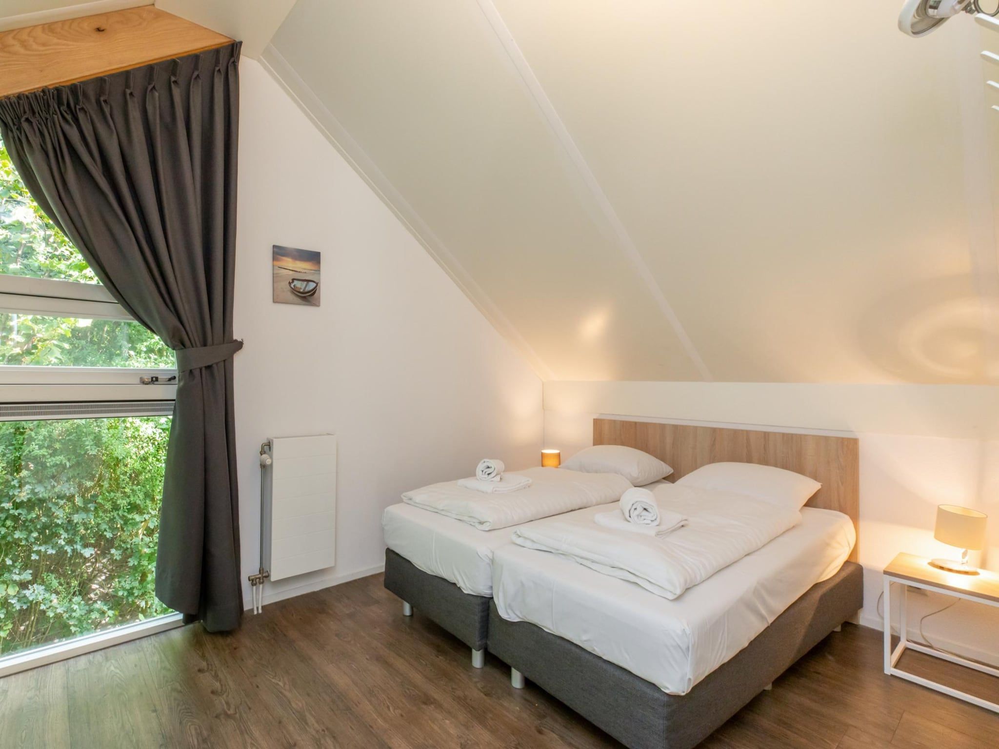 Een slaapkamer van Zonnedorp 23 Zeeland Huis Renesse: Luxury Beach Holiday | Close to North Sea in Renesse