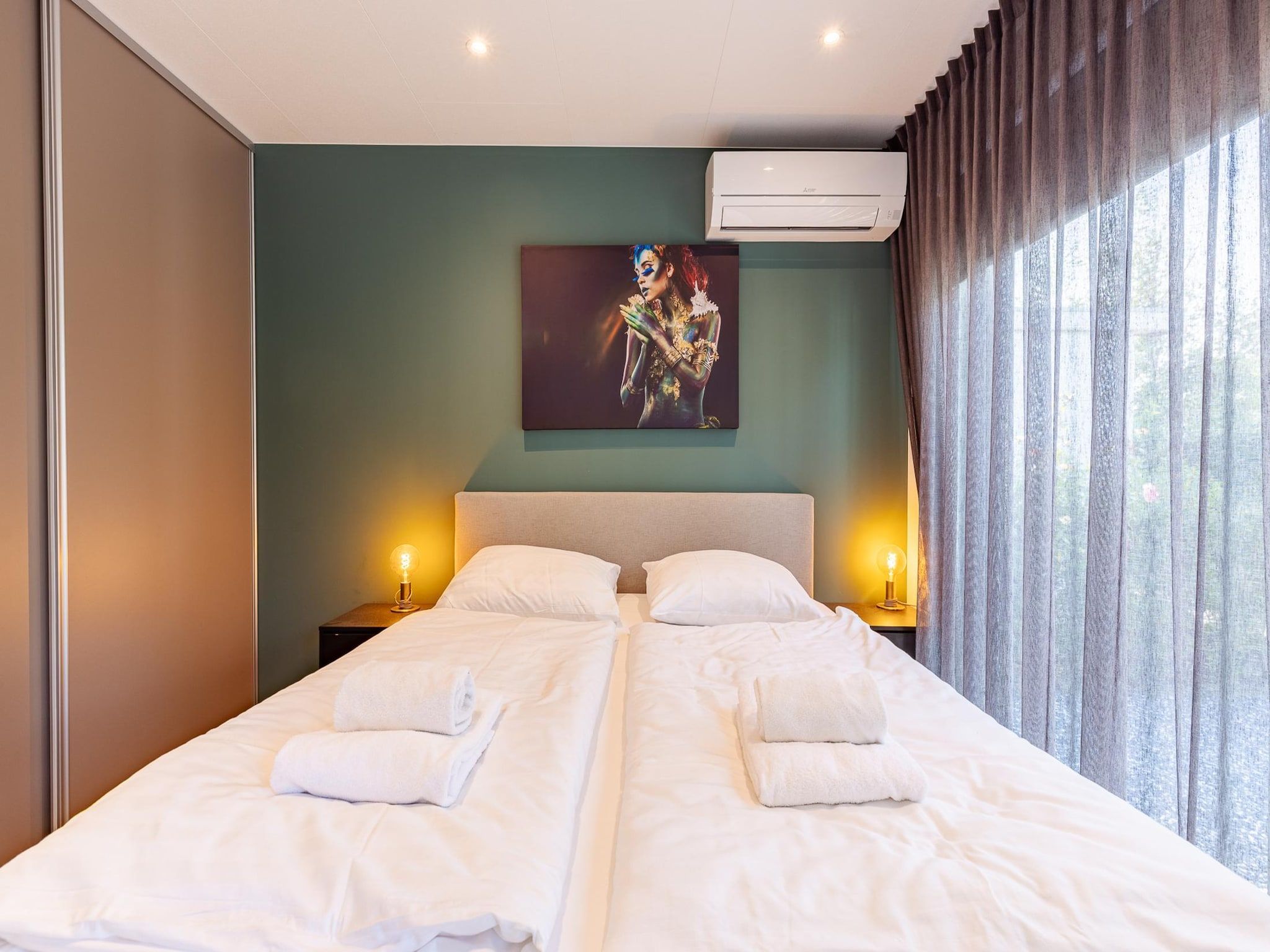 Een slaapkamer van Chalet Julianahoeve | Beachhouse Renesse 2645 in Renesse