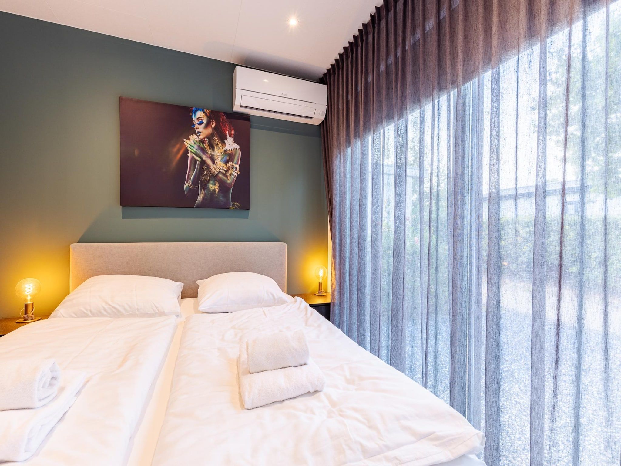 Een slaapkamer van Chalet Julianahoeve | Beachhouse Renesse 2645 in Renesse
