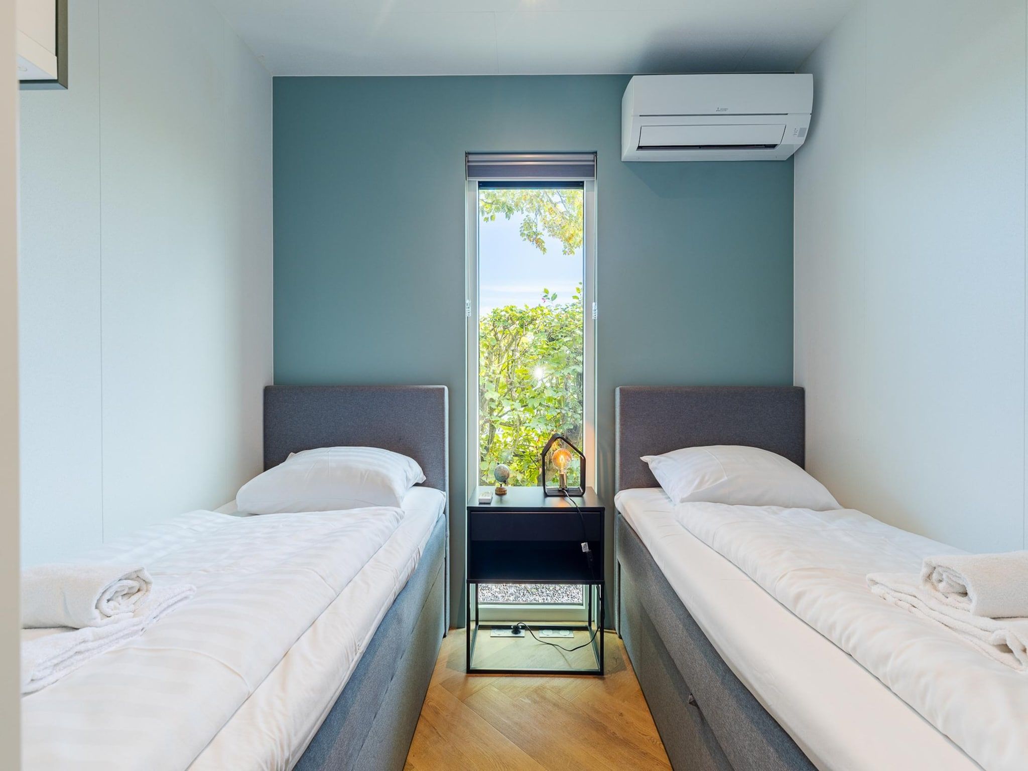 Een slaapkamer van Chalet Julianahoeve | Beachhouse Renesse 2645 in Renesse