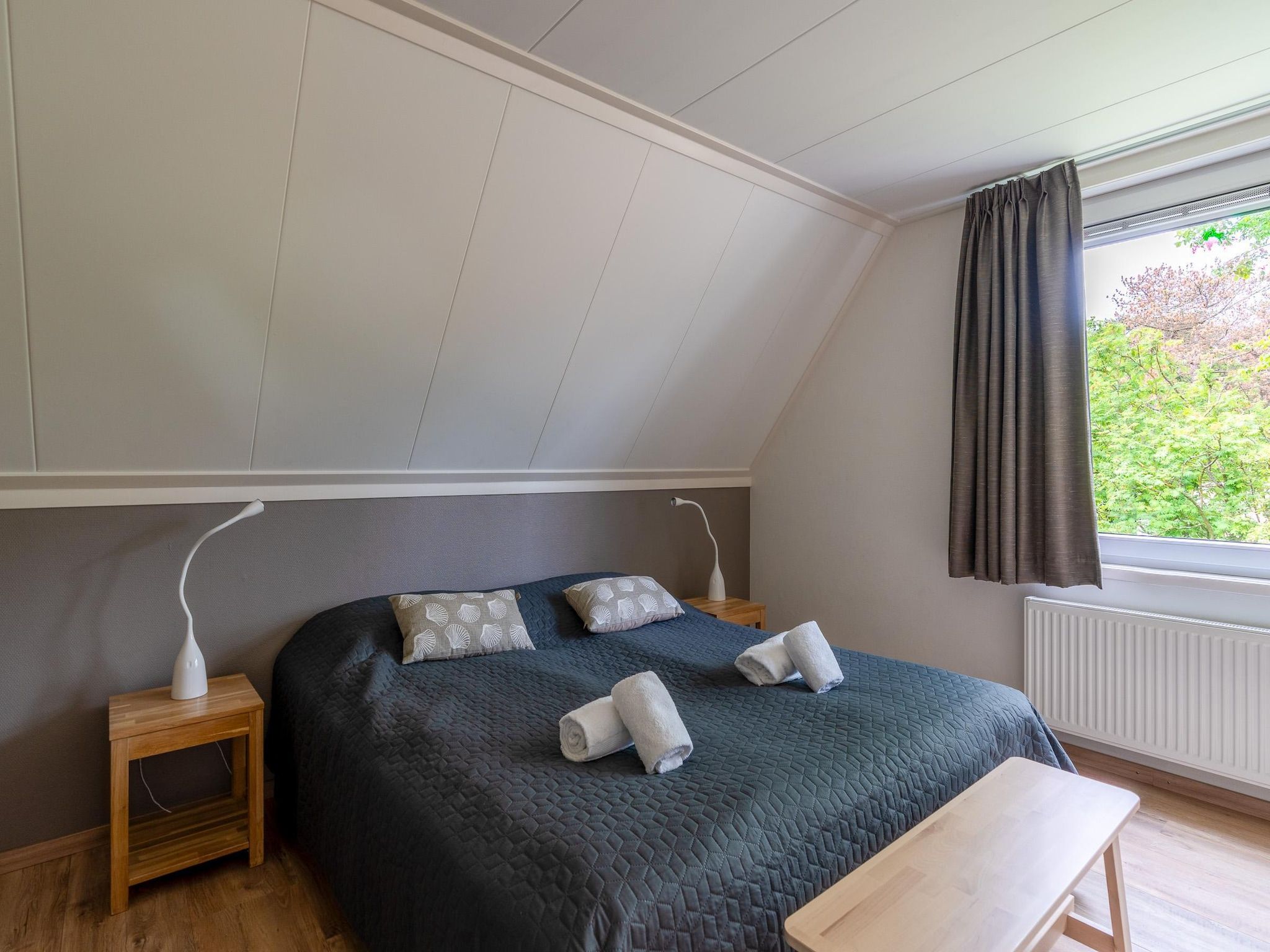 Een slaapkamer van Tempelierweg 23 in Den Burg