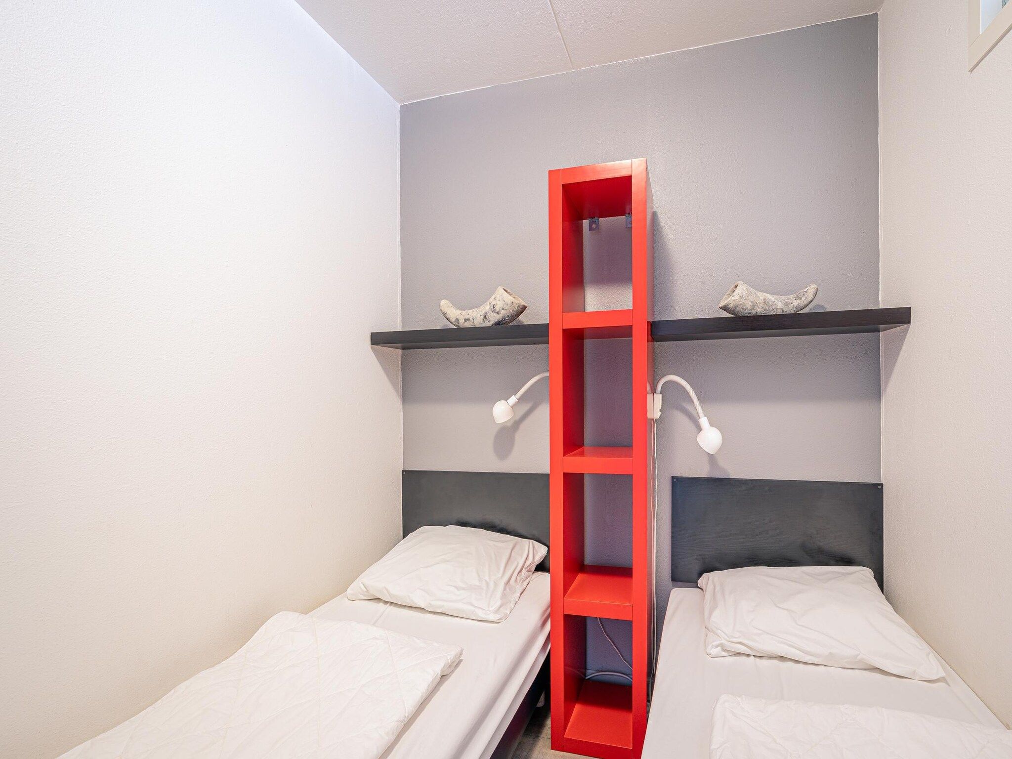 Een slaapkamer van Juliana 046 in De Koog