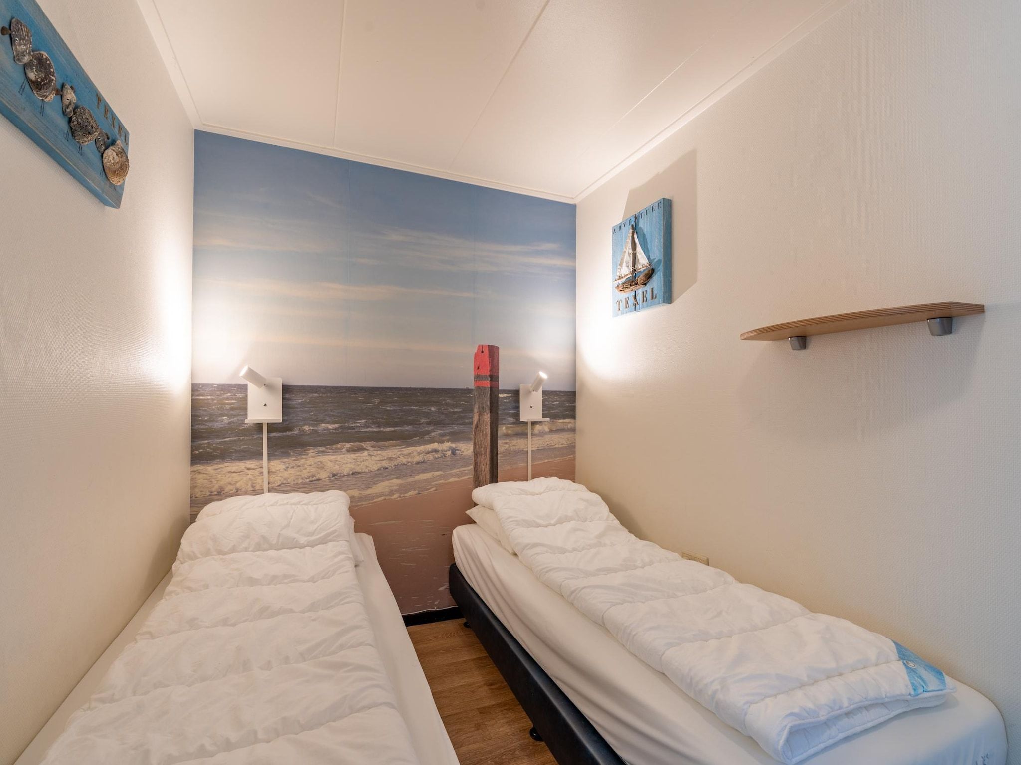 Een slaapkamer van De Anna 218 - Zee in De Koog
