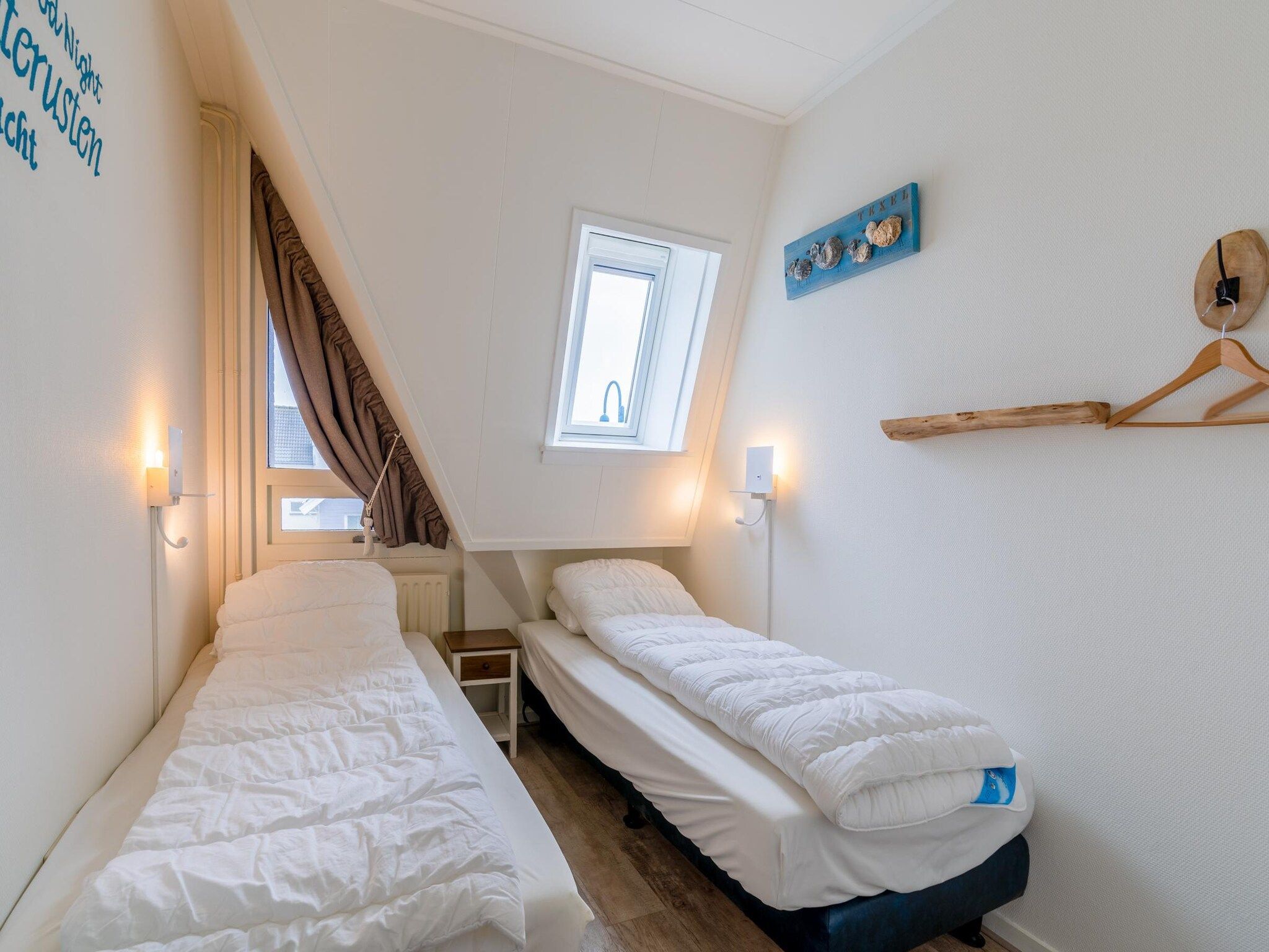 Een slaapkamer van De Anna 222 - Strand in De Koog