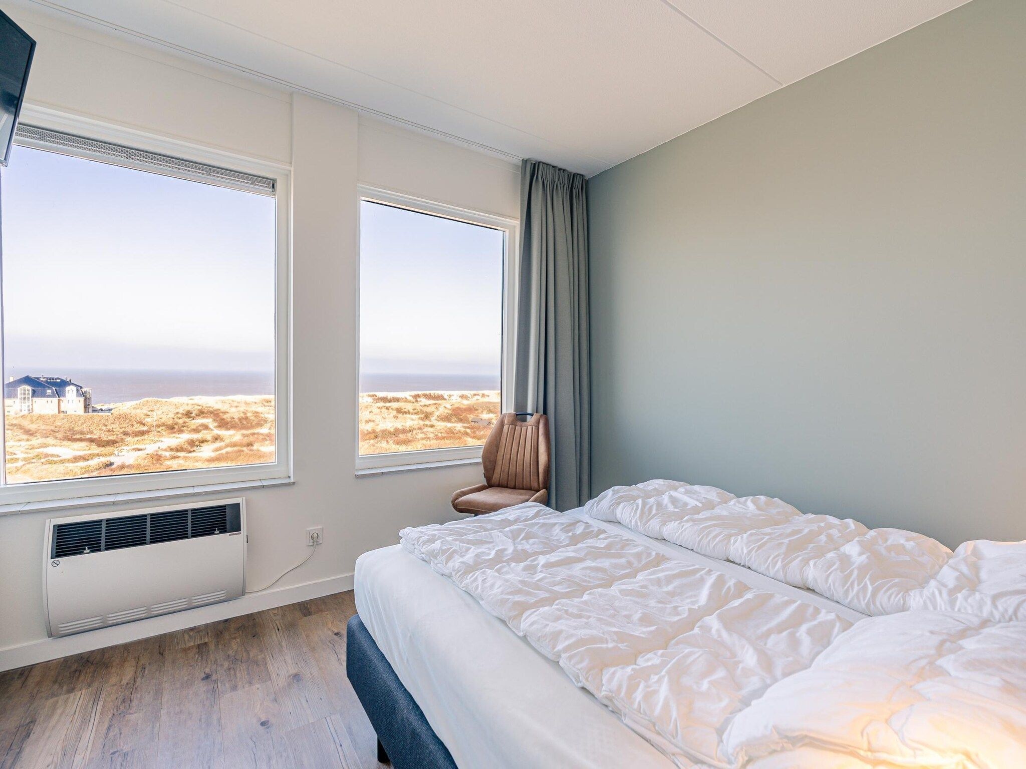 Een slaapkamer van Juliana 150 in De Koog