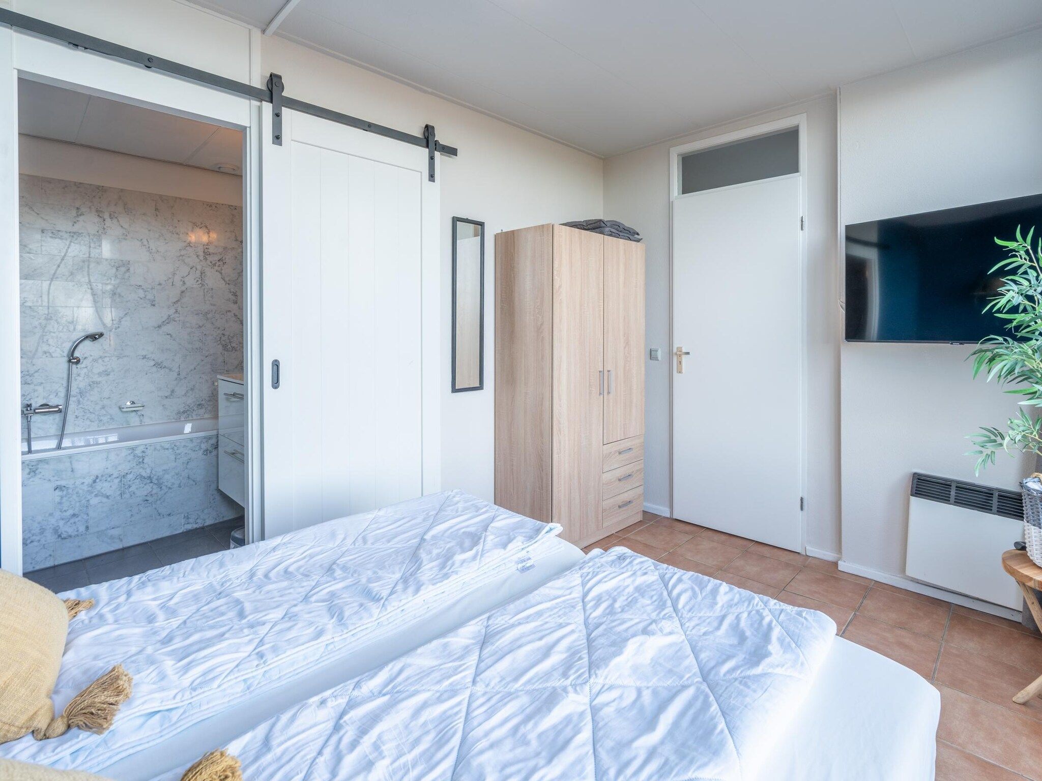 Een slaapkamer van Juliana 062 in De Koog