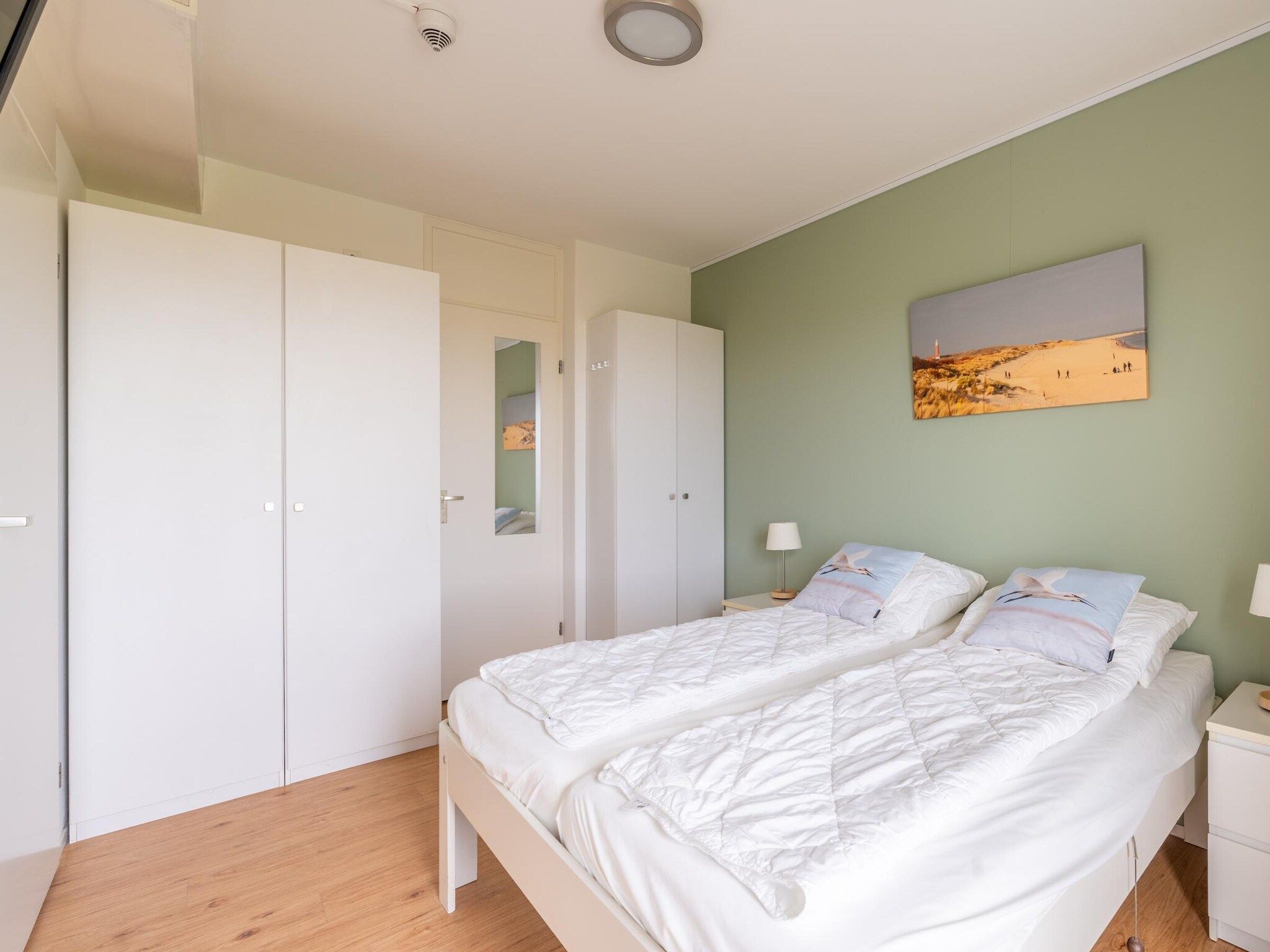Een slaapkamer van Juliana 066 in De Koog