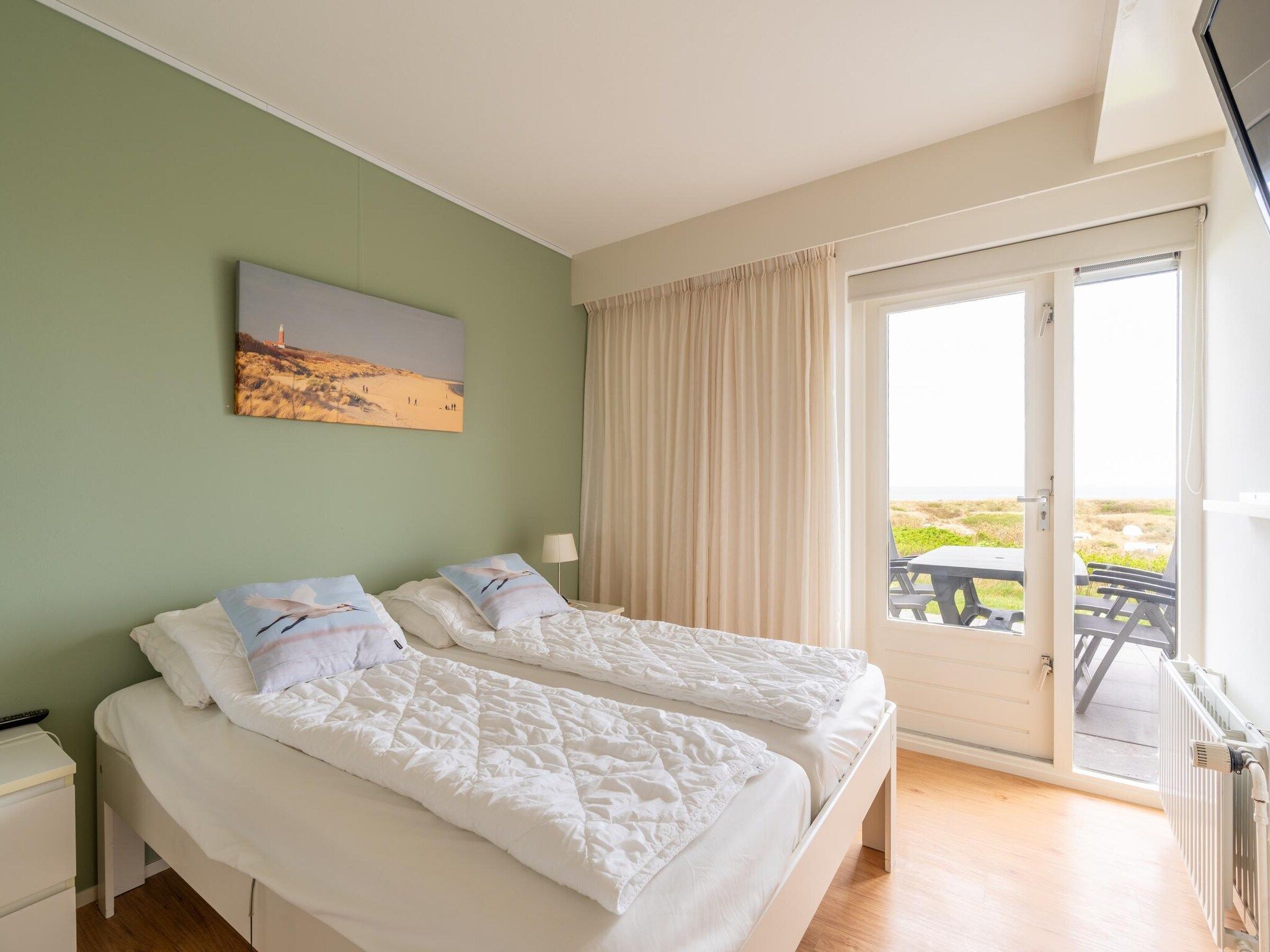 Een slaapkamer van Juliana 066 in De Koog