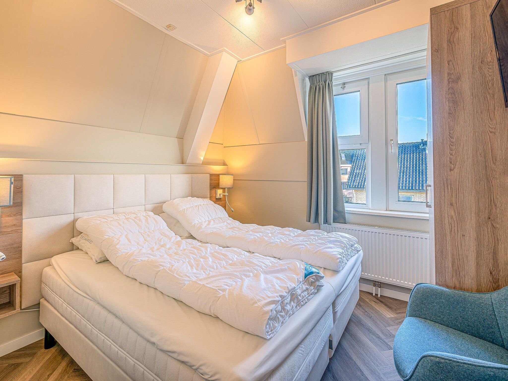 Een slaapkamer van Zeedistel 22 in De Koog