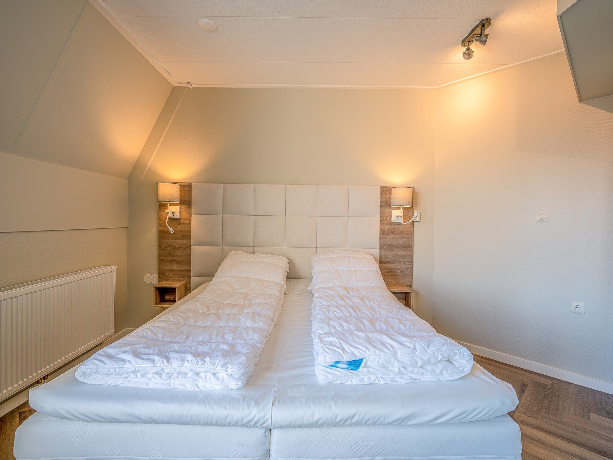 Een slaapkamer van Zeedistel 24 in De Koog