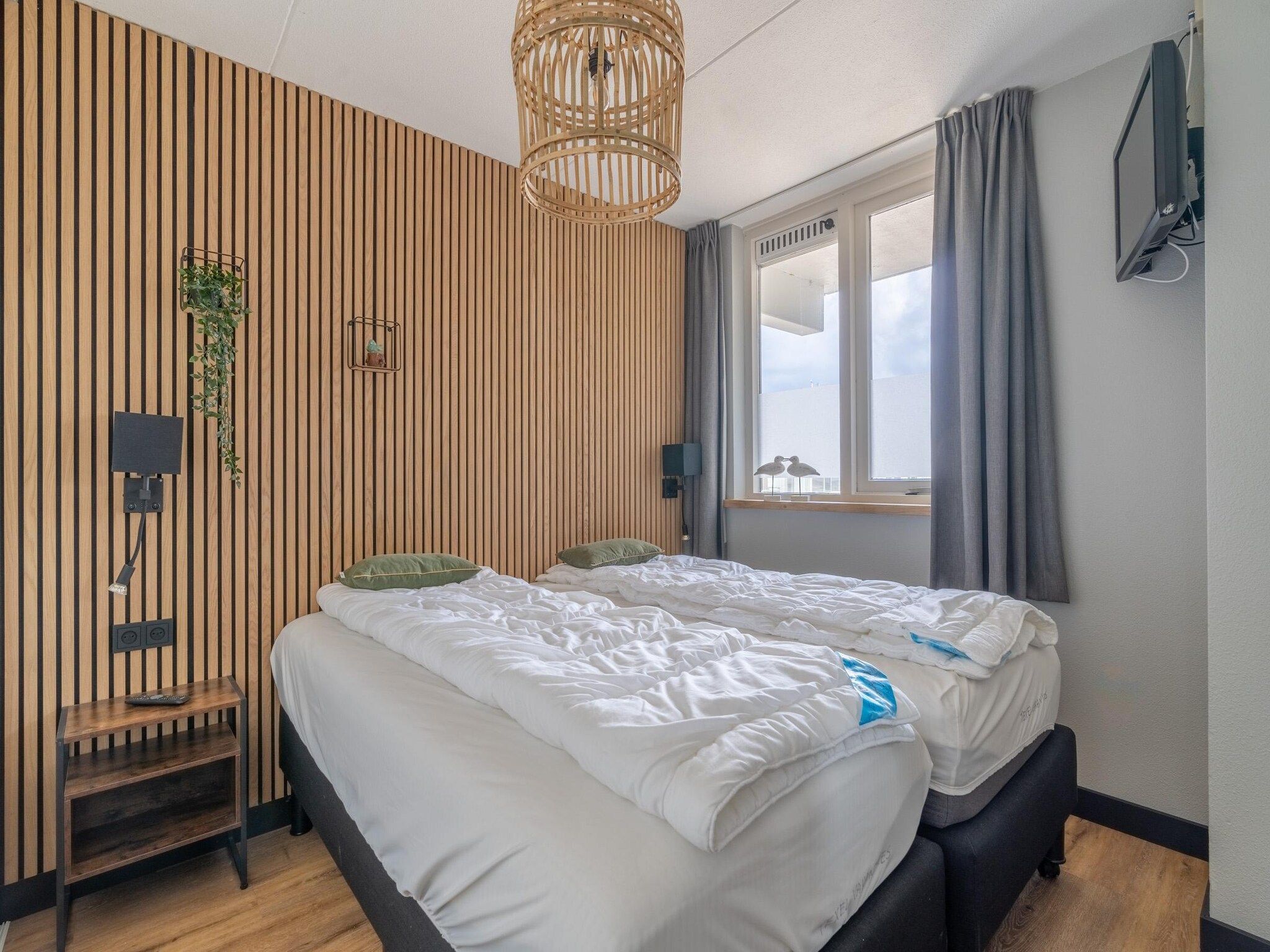 Een slaapkamer van Juliana 086 in De Koog