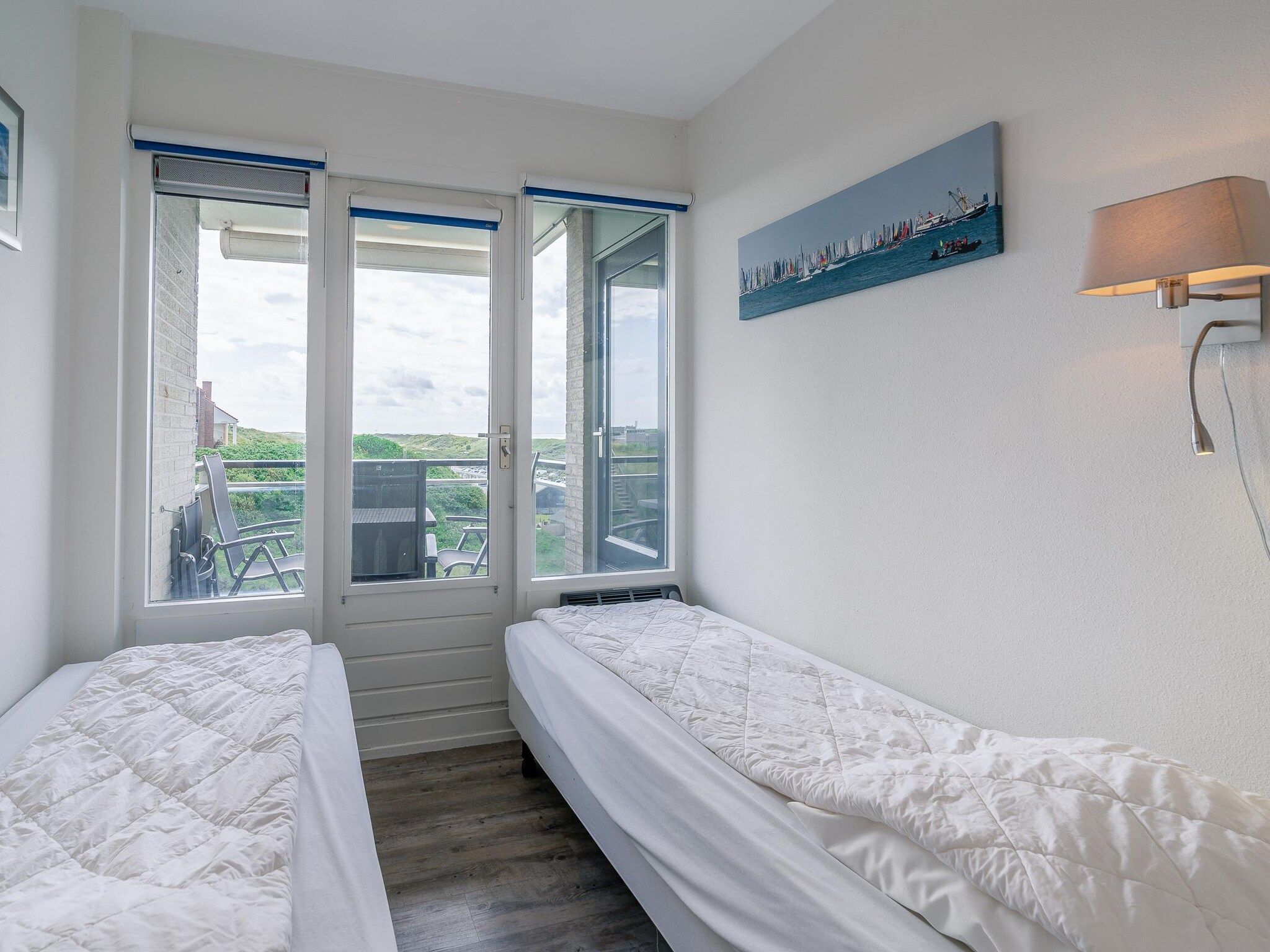 Een slaapkamer van Juliana 100 in De Koog
