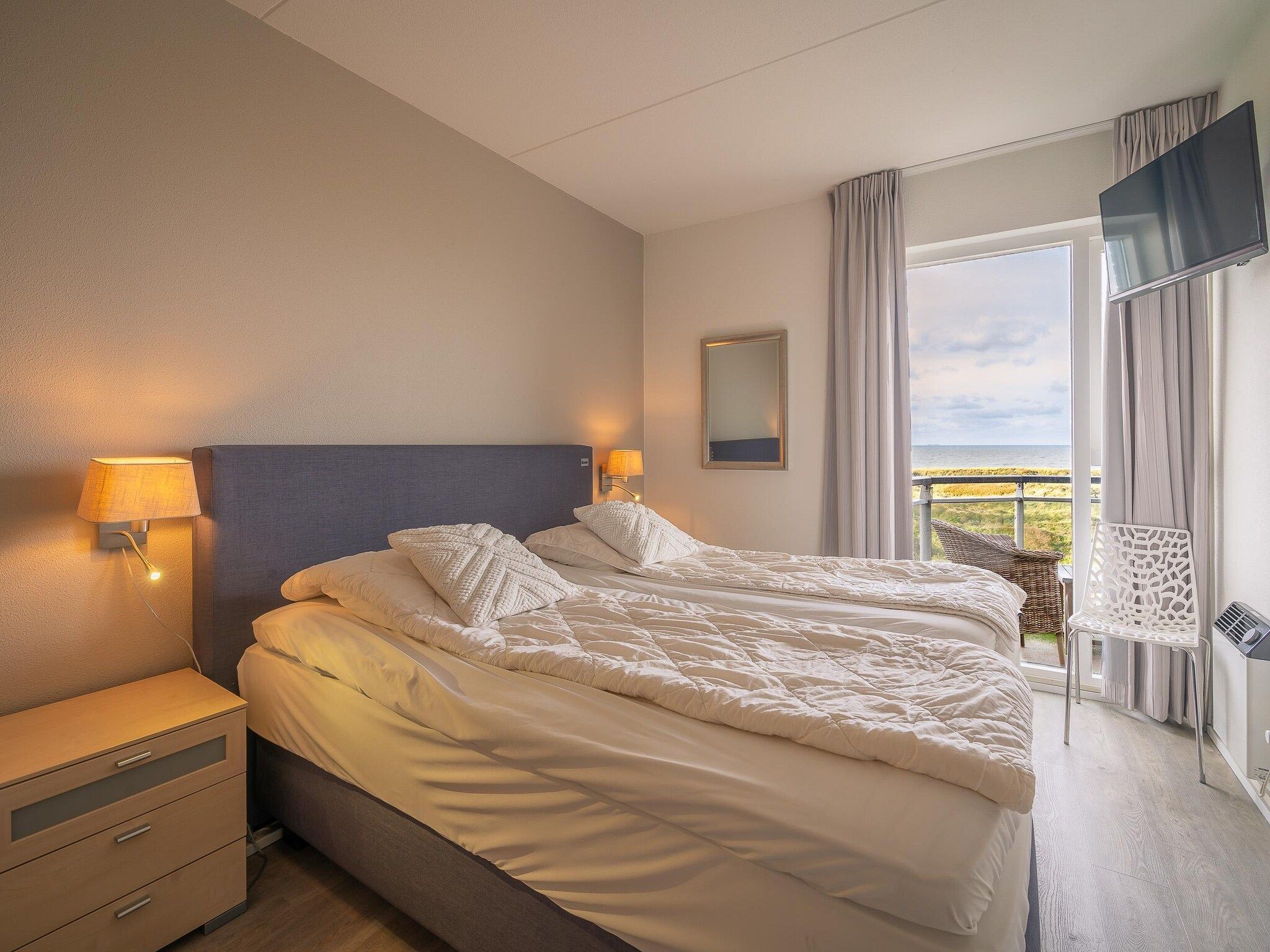 Een slaapkamer van Juliana 116 in De Koog