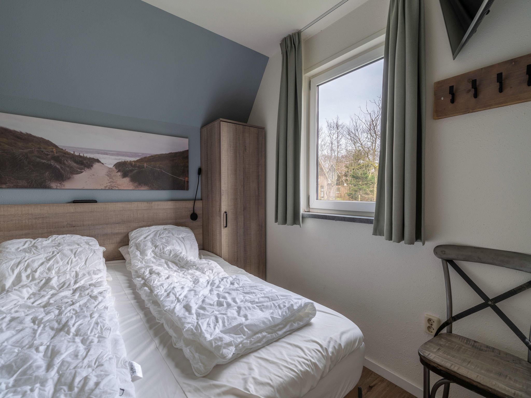 Een slaapkamer van Nieuwlanderweg 77 in De Waal