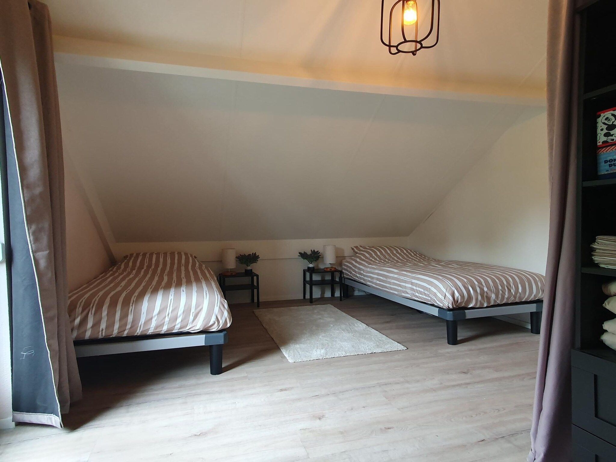 Een slaapkamer van 7 - Persoons Forest 217 Sauna Bungalow in Ewijk