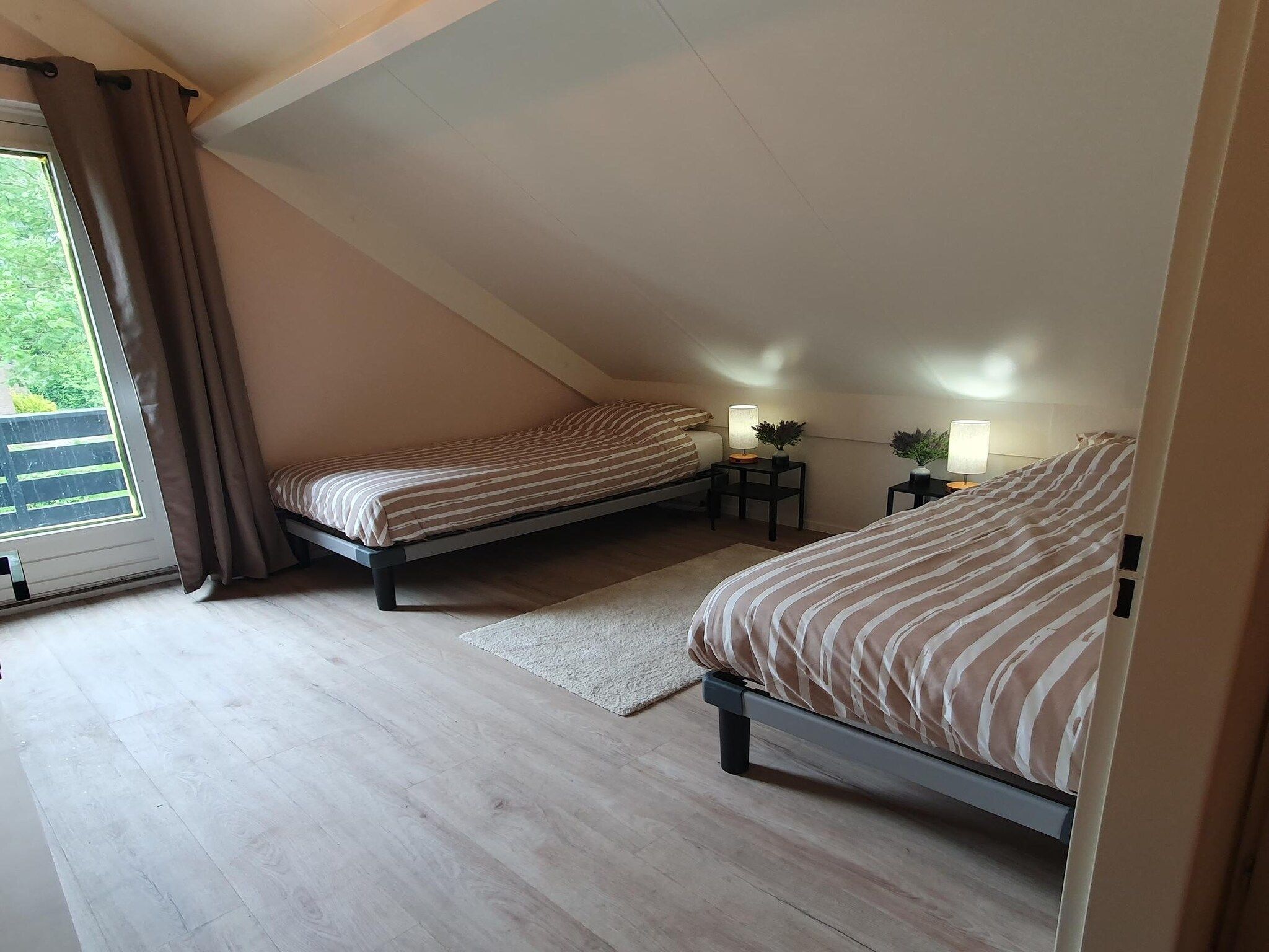 Een slaapkamer van 7 - Persoons Forest 217 Sauna Bungalow in Ewijk