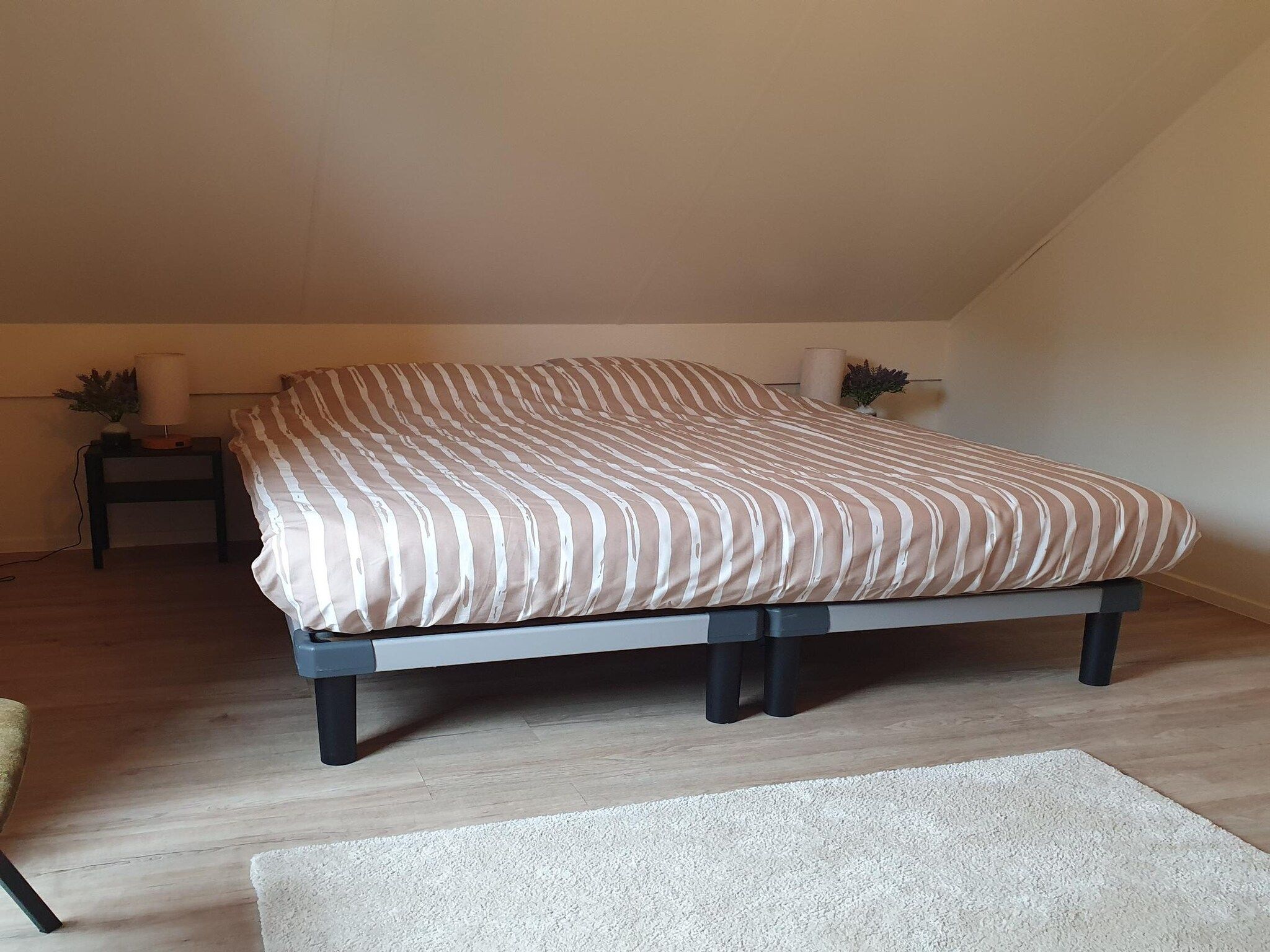 Een slaapkamer van 7 - Persoons Forest 217 Sauna Bungalow in Ewijk