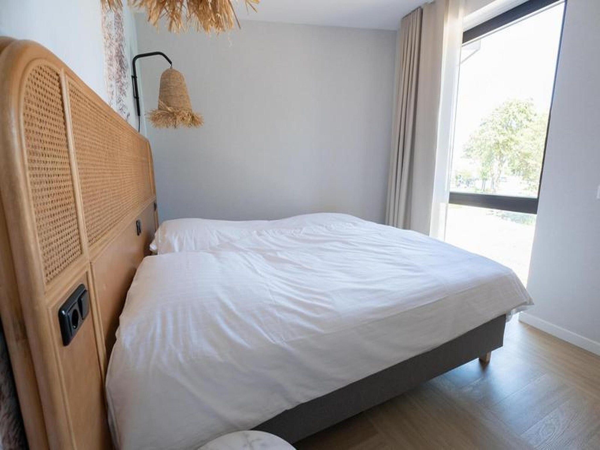 Een slaapkamer van Luxury Beach Apartment | 8 Pers. in Workum